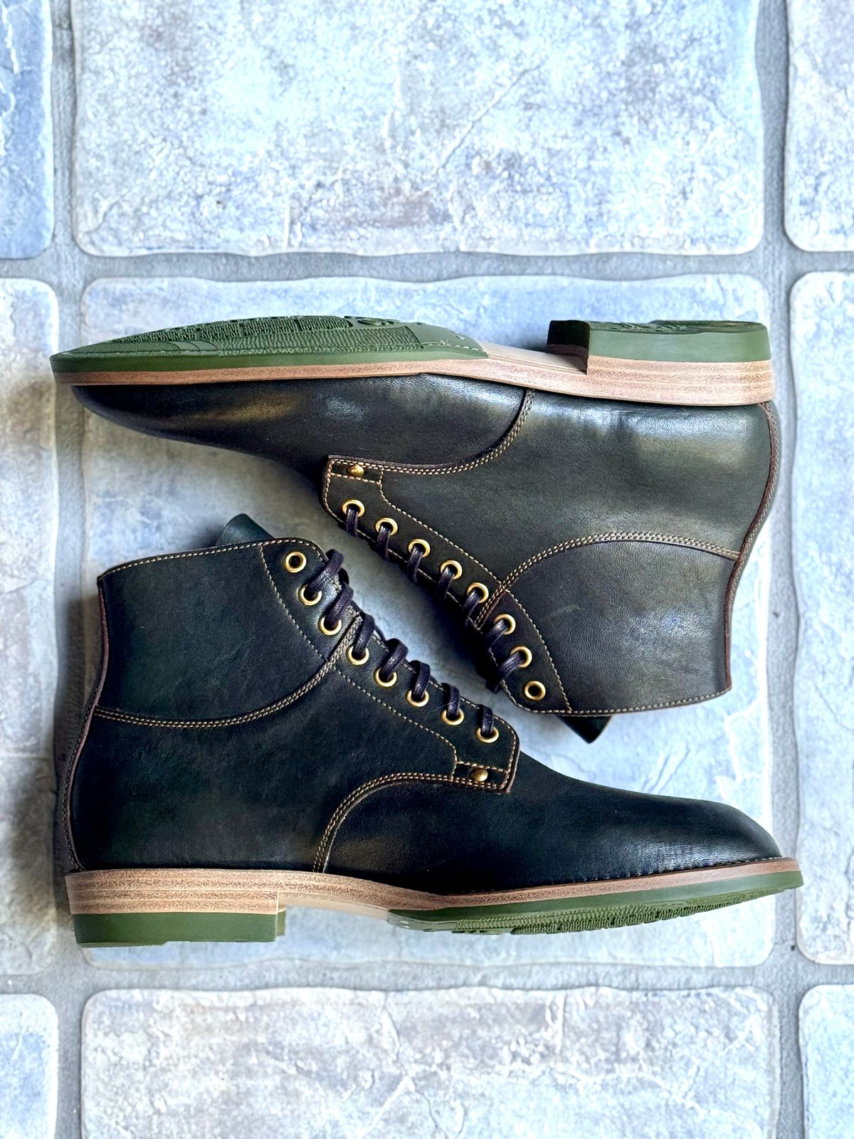 Photo by ScuffedUpKicks on October 2, 2025 of the Iron Boots x Østmo Type 1 in Maryam Dark Green Hand-Dyed Horsehide.