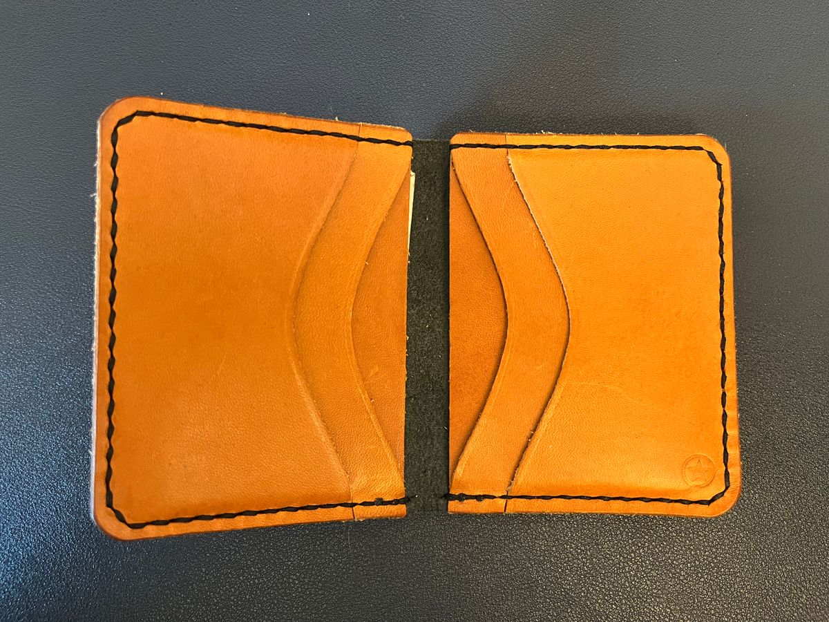 Photo by tomsbarkingdogs on December 3, 2025 of the One Star Leather Goods 6 Pocket Horizontal Learher Wallet in Horween Black/Yellow Buttero.