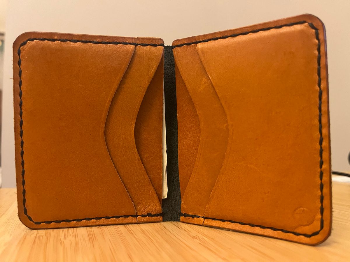 Photo by tomsbarkingdogs on January 6, 2026 of the One Star Leather Goods 6 Pocket Horizontal Learher Wallet in Horween Black/Yellow Buttero.