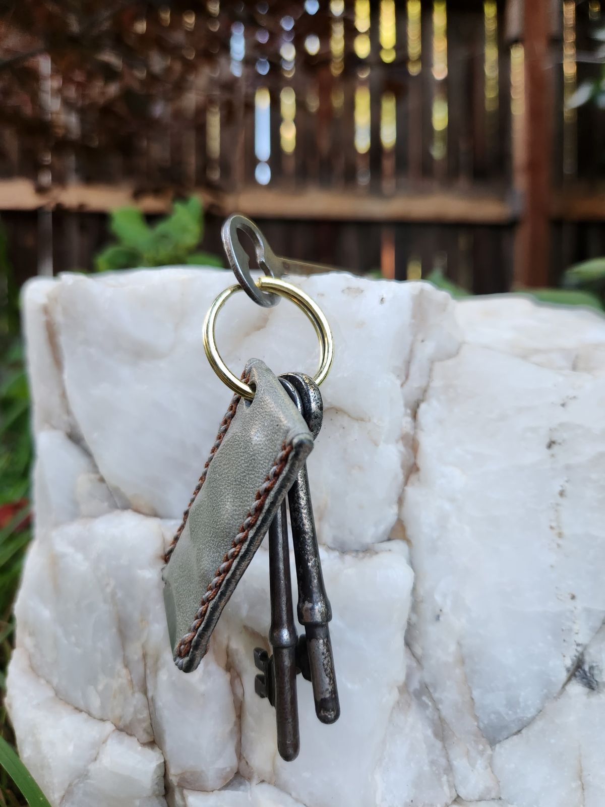 Photo by spyder550 on October 5, 2025 of the Self-Made Keychain/Bottle Opener in Wickett & Craig Grey Traditional Harness.