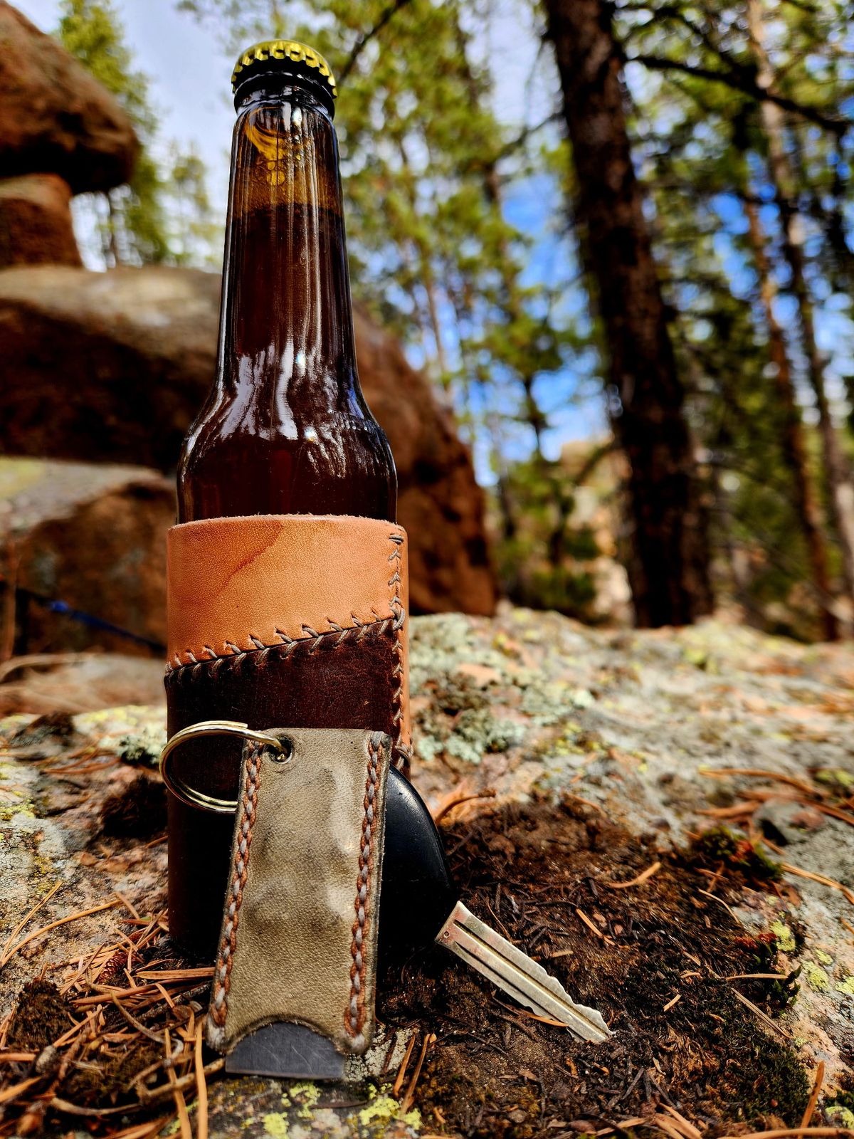 Photo by spyder550 on November 3, 2025 of the Self-Made Keychain/Bottle Opener in Wickett & Craig Grey Traditional Harness.