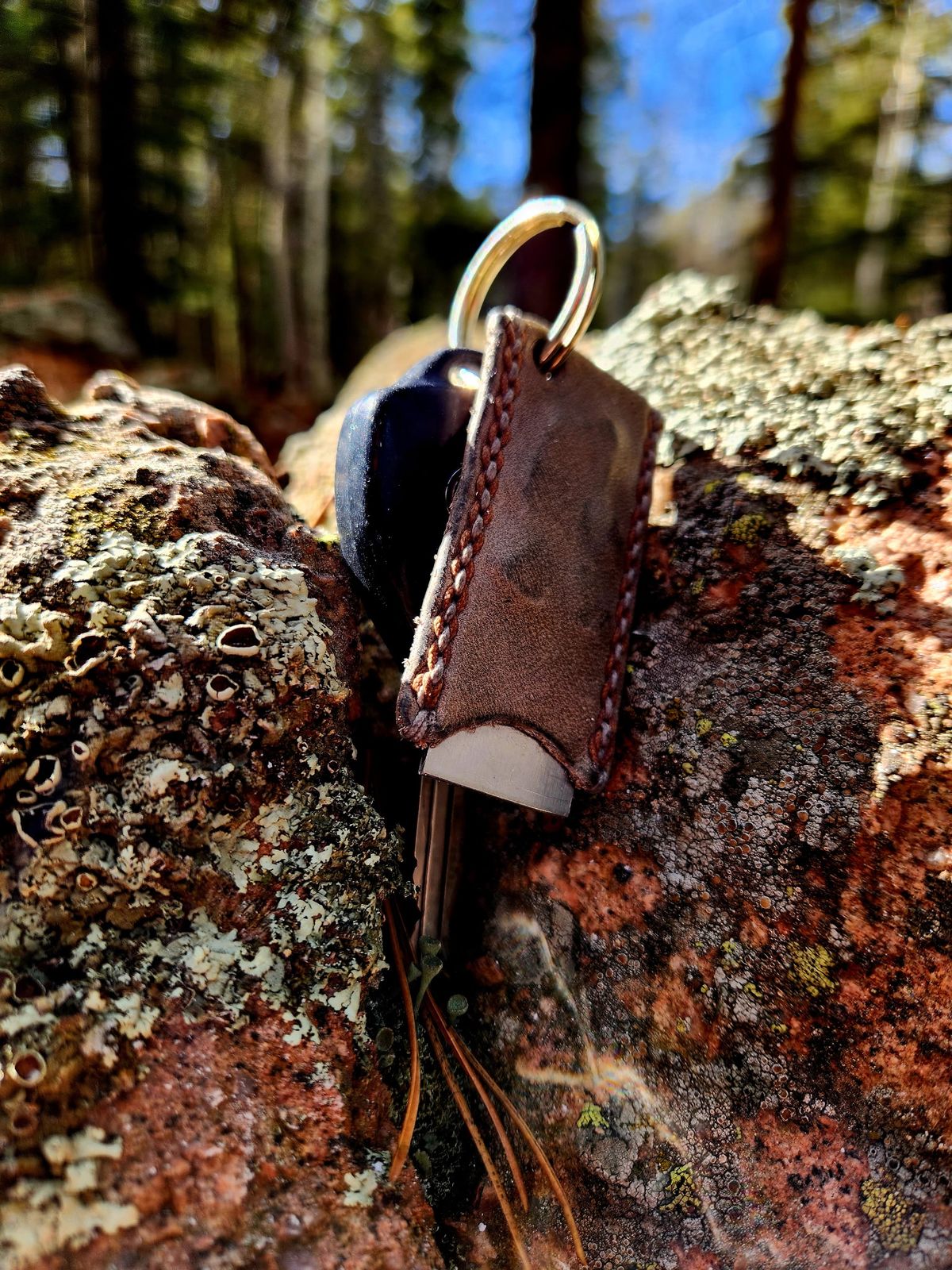 Photo by spyder550 on November 3, 2025 of the Self-Made Keychain/Bottle Opener in Wickett & Craig Grey Traditional Harness.