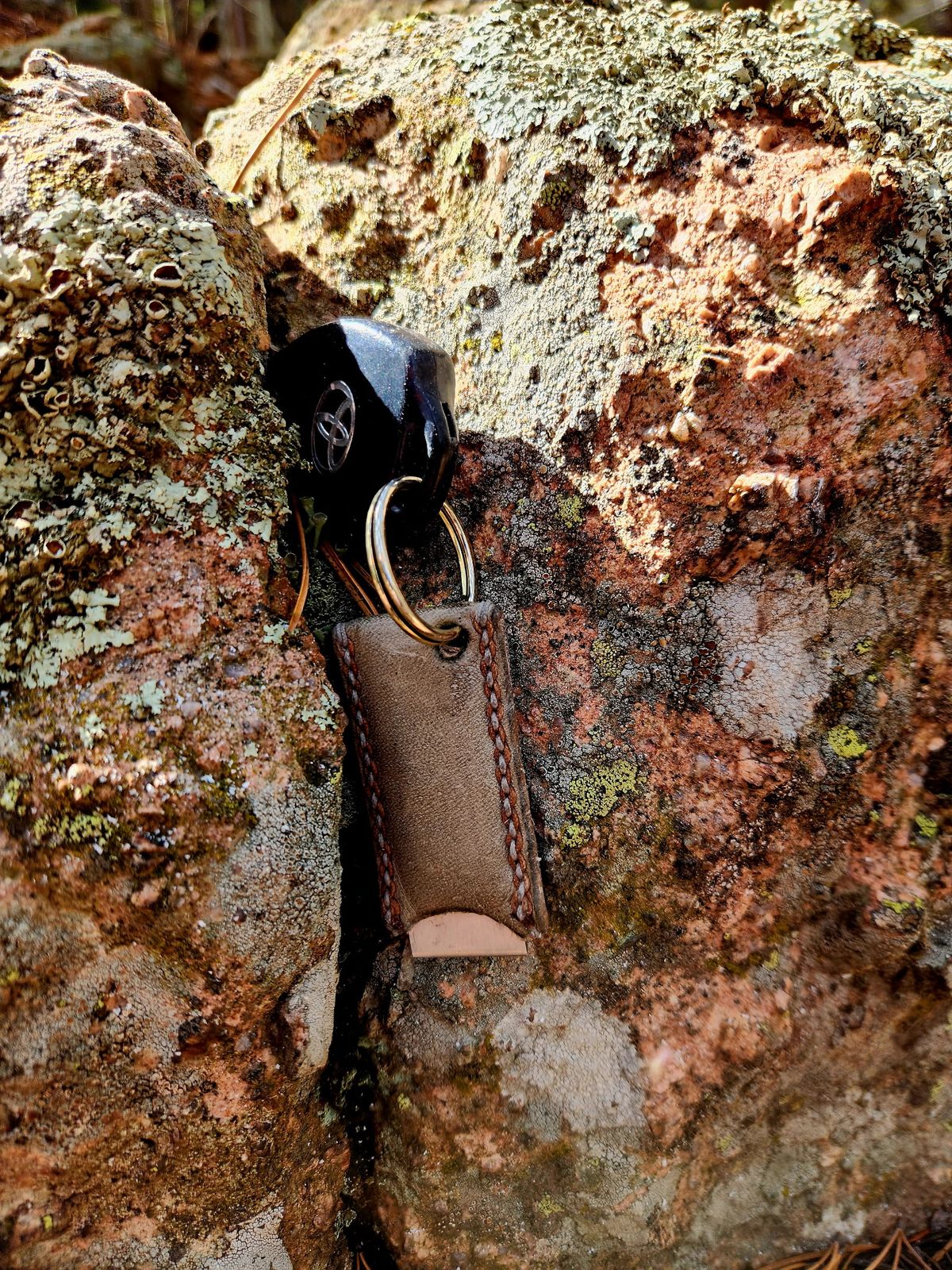 Photo by spyder550 on November 3, 2025 of the Self-Made Keychain/Bottle Opener in Wickett & Craig Grey Traditional Harness.