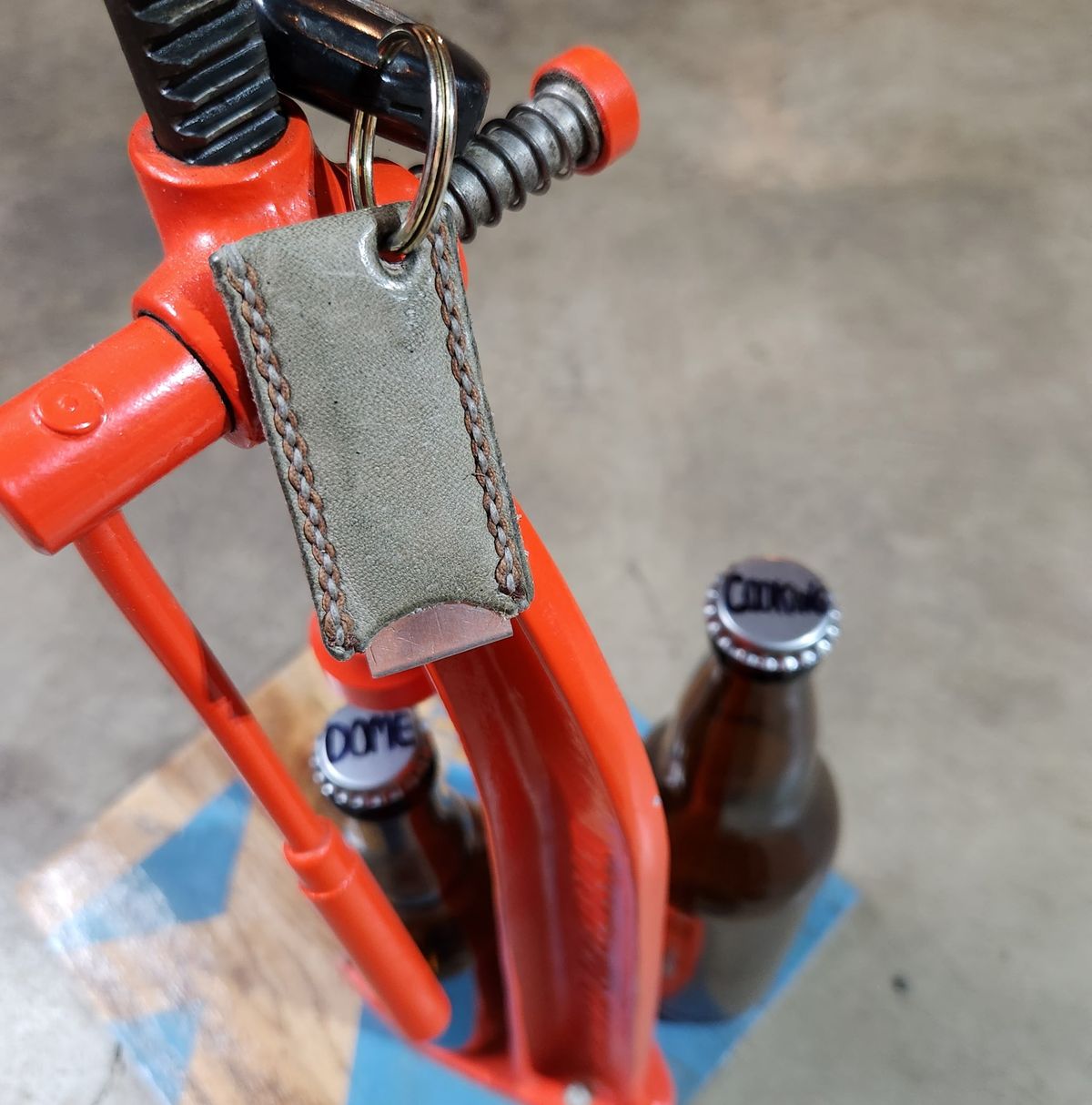 Photo by spyder550 on November 3, 2025 of the Self-Made Keychain/Bottle Opener in Wickett & Craig Grey Traditional Harness.