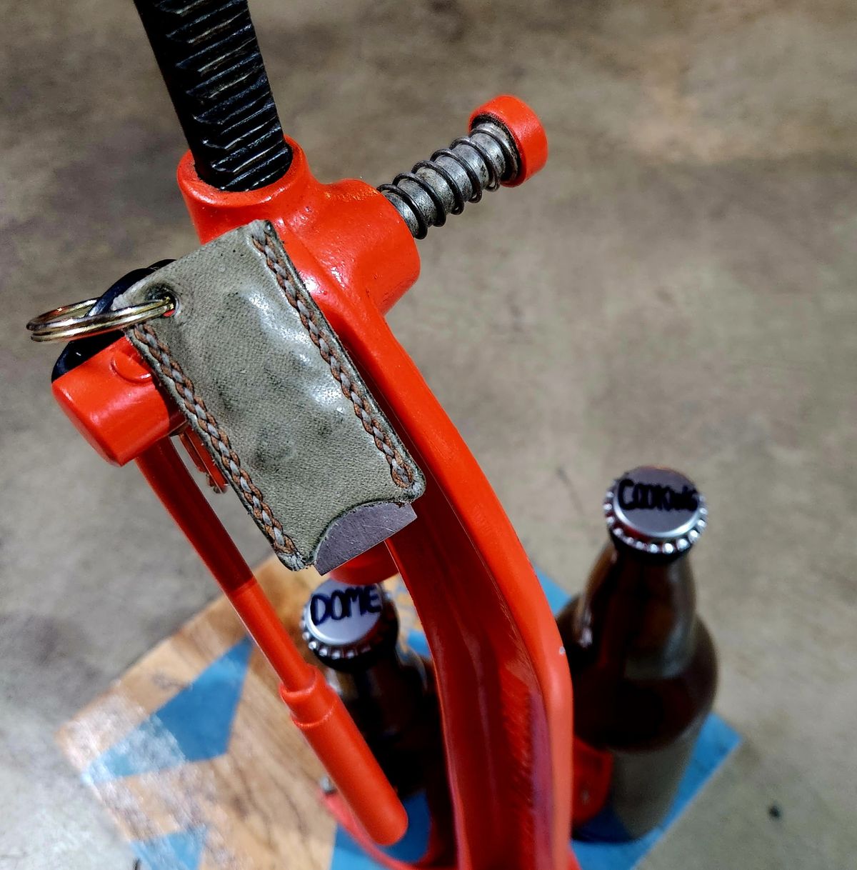 Photo by spyder550 on November 3, 2025 of the Self-Made Keychain/Bottle Opener in Wickett & Craig Grey Traditional Harness.