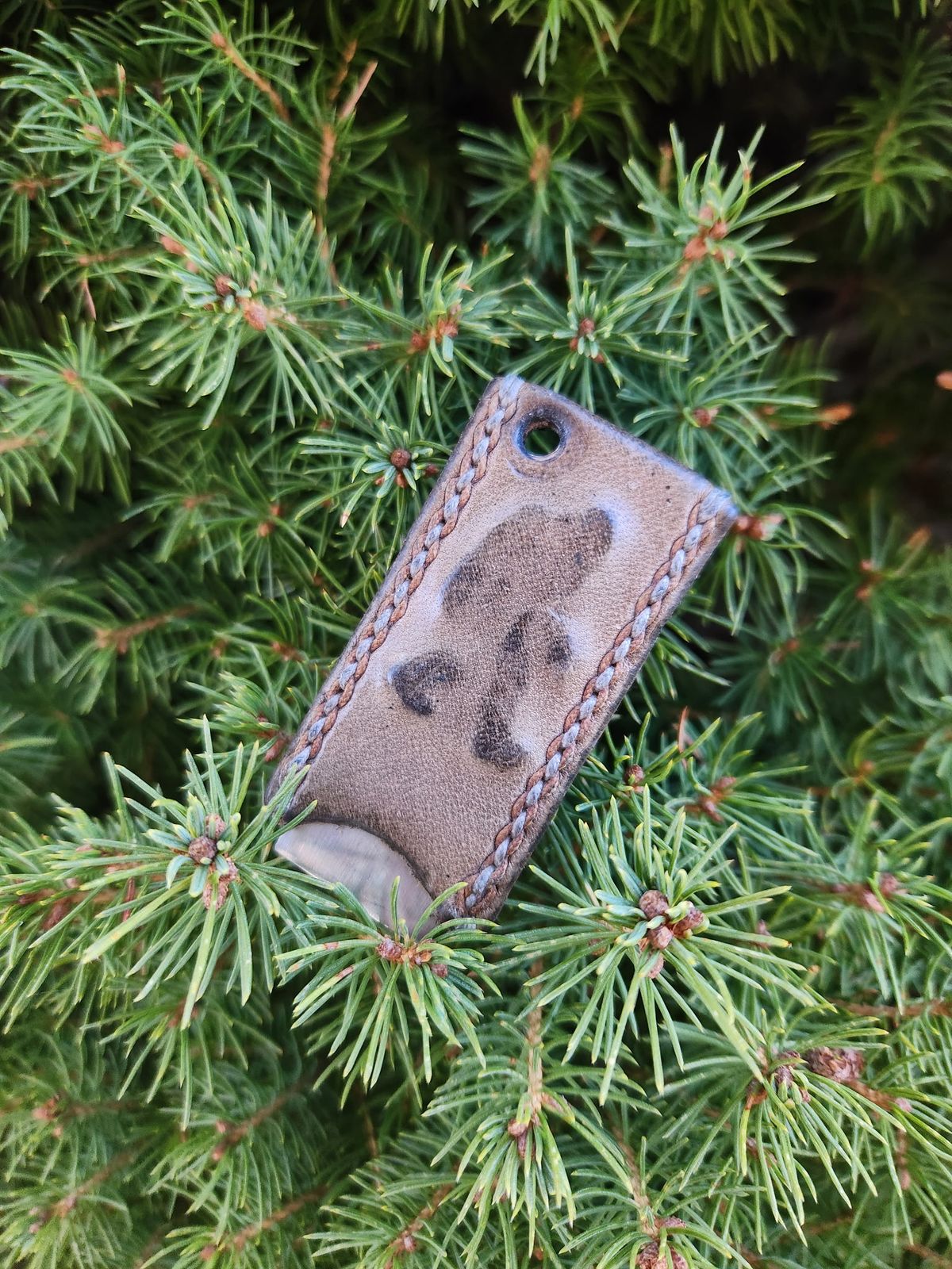 Photo by spyder550 on February 5, 2026 of the Self-Made Keychain/Bottle Opener in Wickett & Craig Grey Traditional Harness.