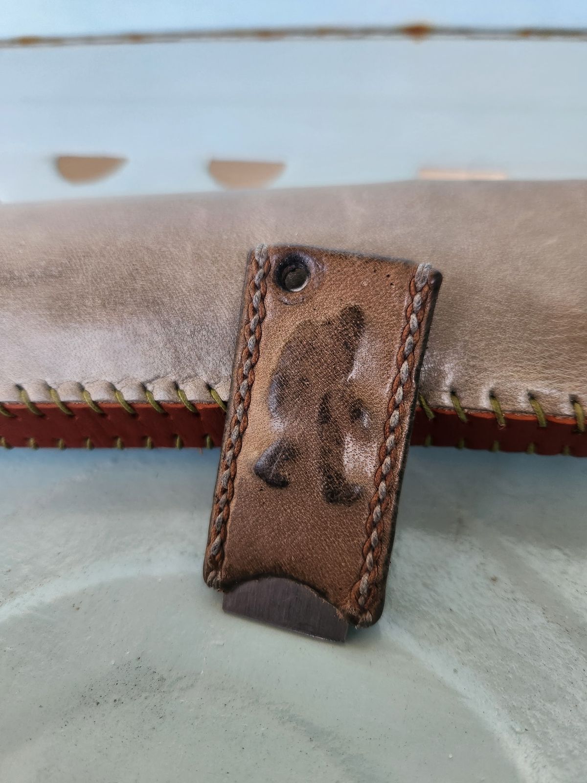 Photo by spyder550 on February 5, 2026 of the Self-Made Keychain/Bottle Opener in Wickett & Craig Grey Traditional Harness.