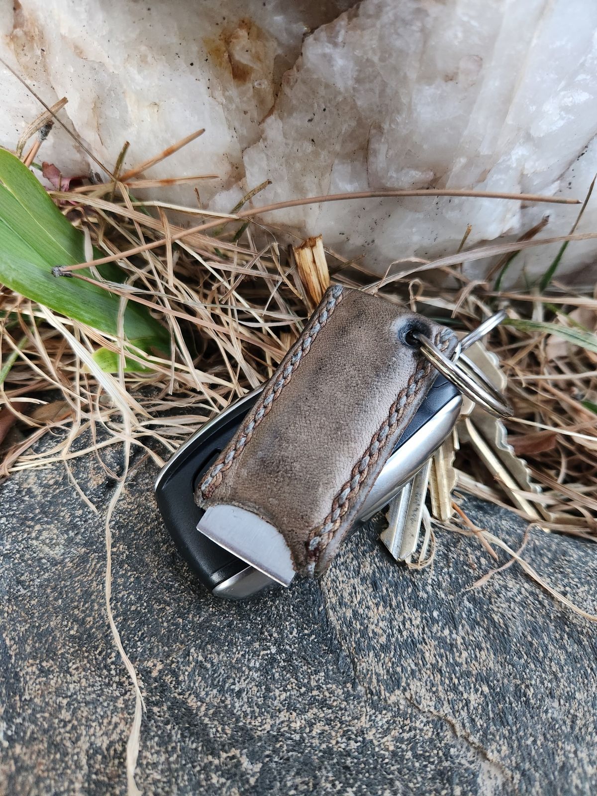 Photo by spyder550 on March 5, 2026 of the Self-Made Keychain/Bottle Opener in Wickett & Craig Grey Traditional Harness.