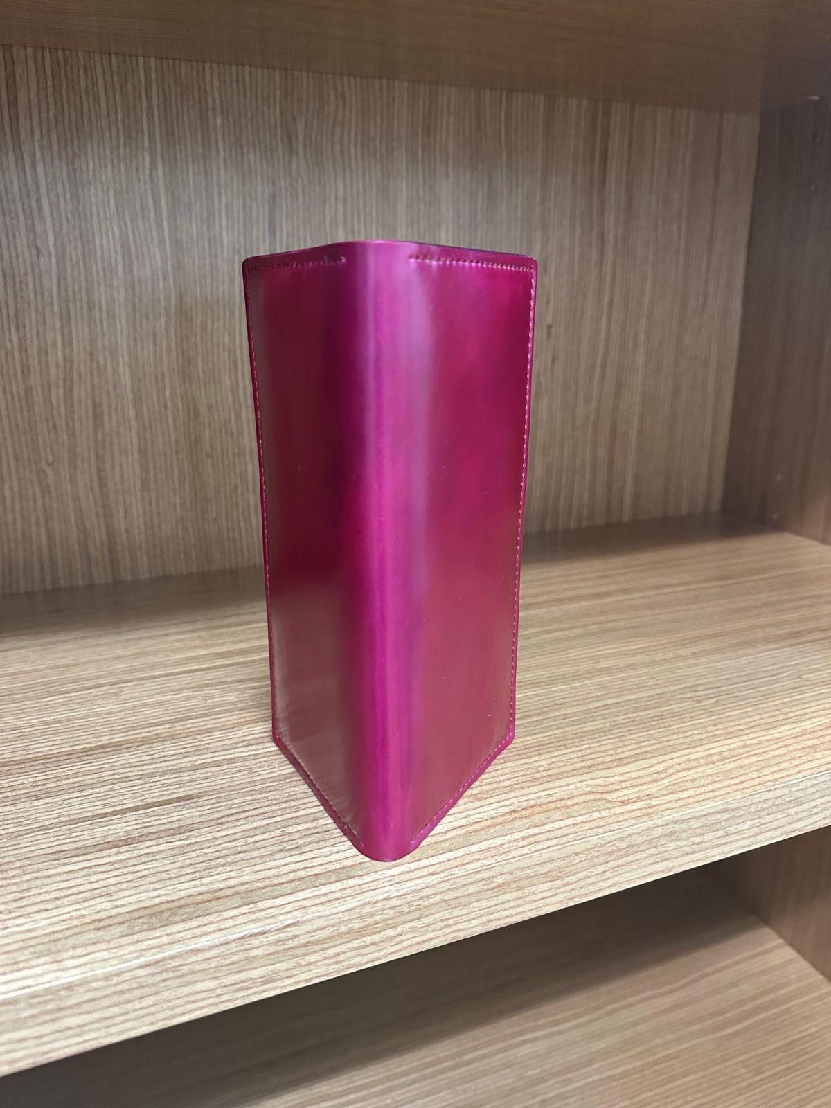 Photo by Huntsman on November 6, 2025 of the Ashland Leather Long Wallet in Horween Ultraviolet Shell Cordovan.