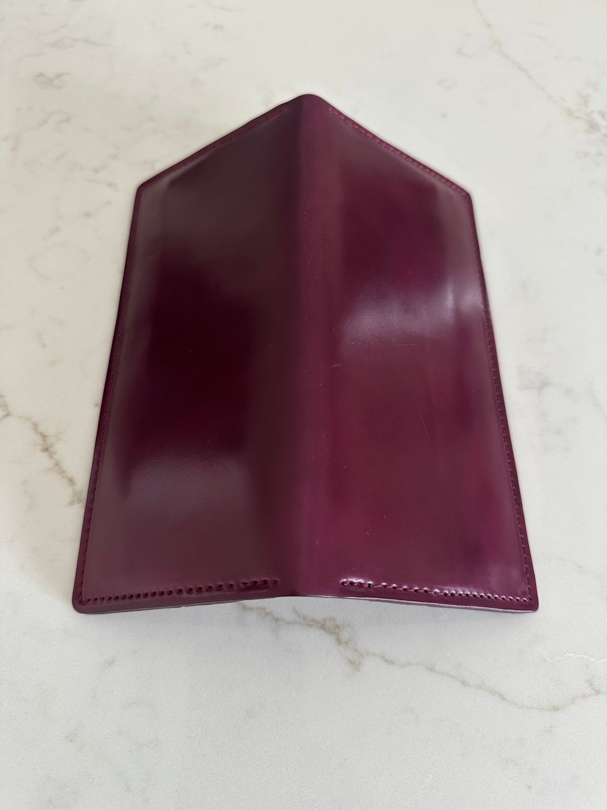 Photo by Huntsman on December 5, 2025 of the Ashland Leather Long Wallet in Horween Ultraviolet Shell Cordovan.