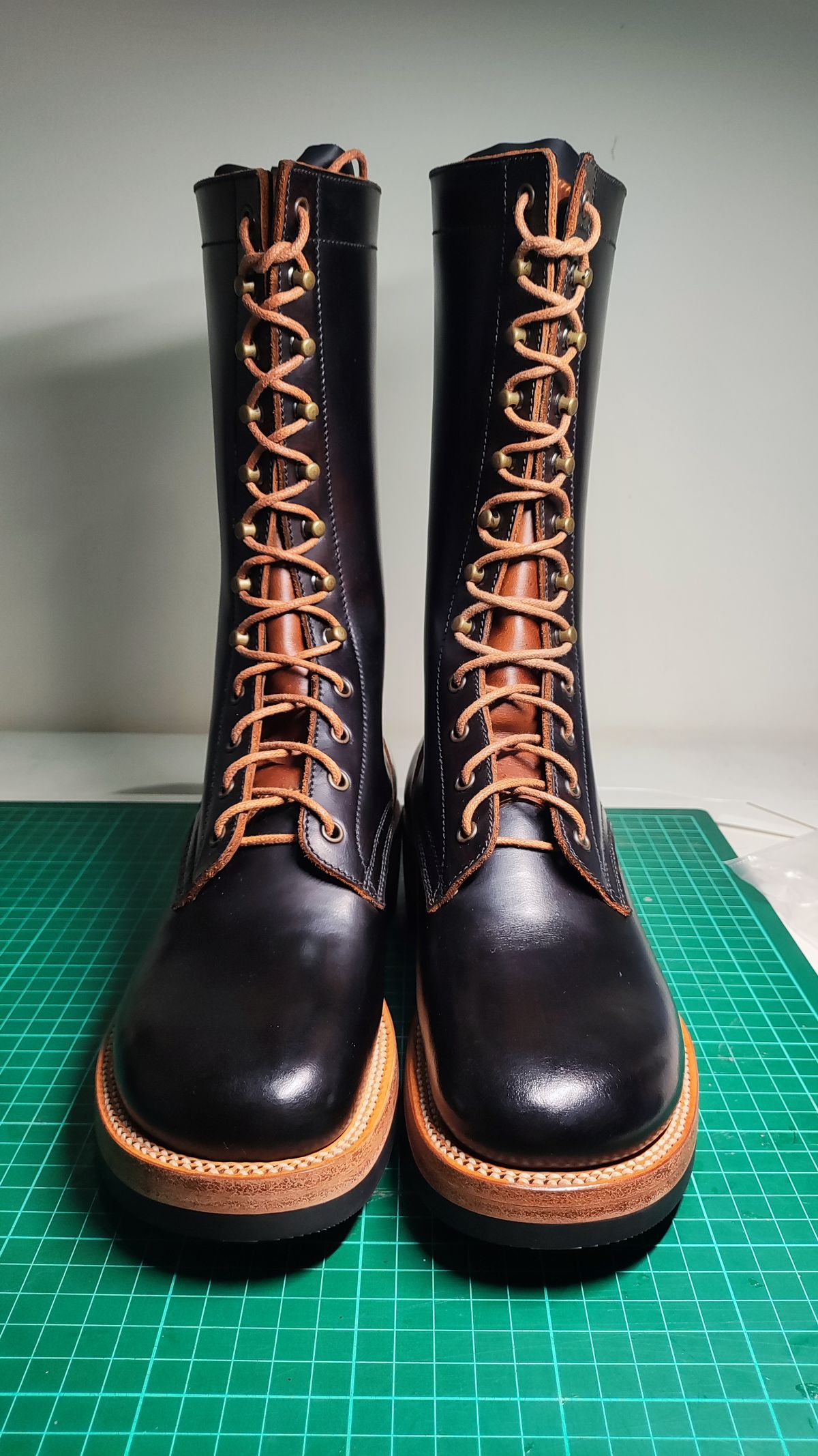 Photo by julio_archieve on September 24, 2025 of the Fortis Boots Logger Boots in Indonesian Red Brown Pull Up Overdyed Black.