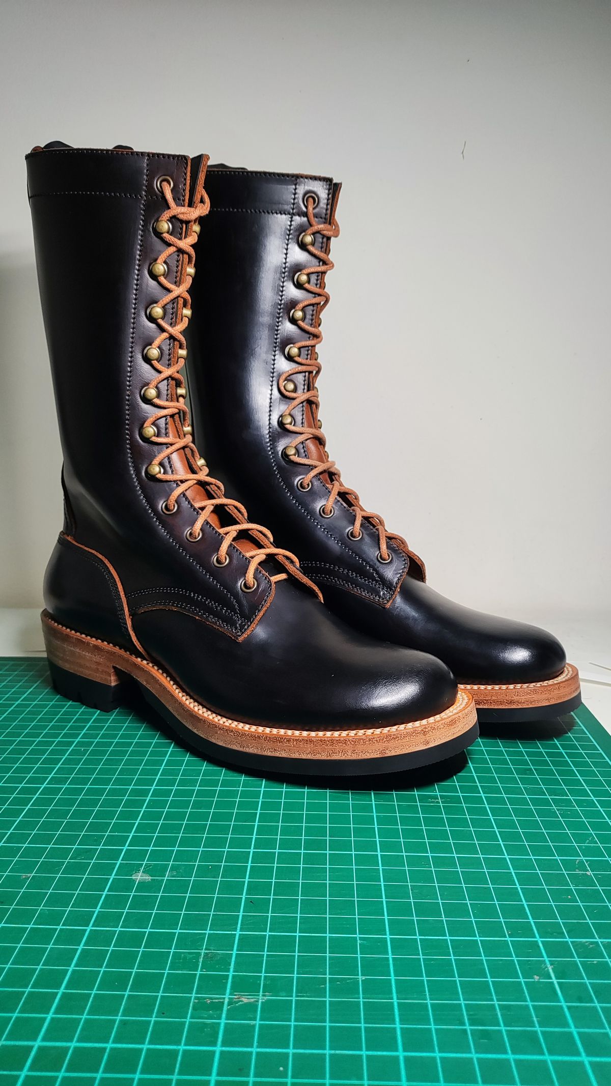 Photo by julio_archieve on September 24, 2025 of the Fortis Boots Logger Boots in Indonesian Red Brown Pull Up Overdyed Black.