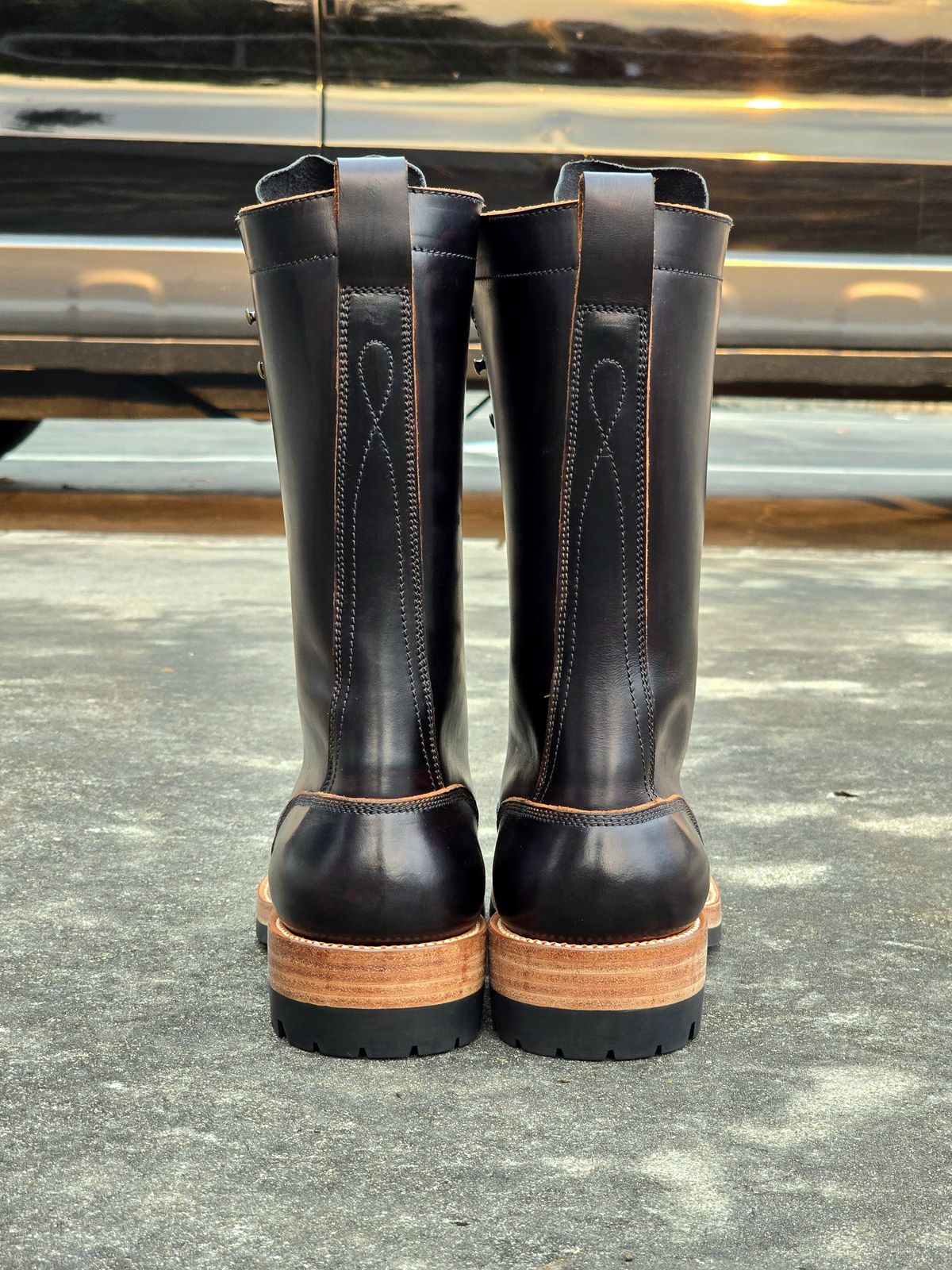 Photo by julio_archieve on October 5, 2025 of the Fortis Boots Logger Boots in Indonesian Red Brown Pull Up Overdyed Black.