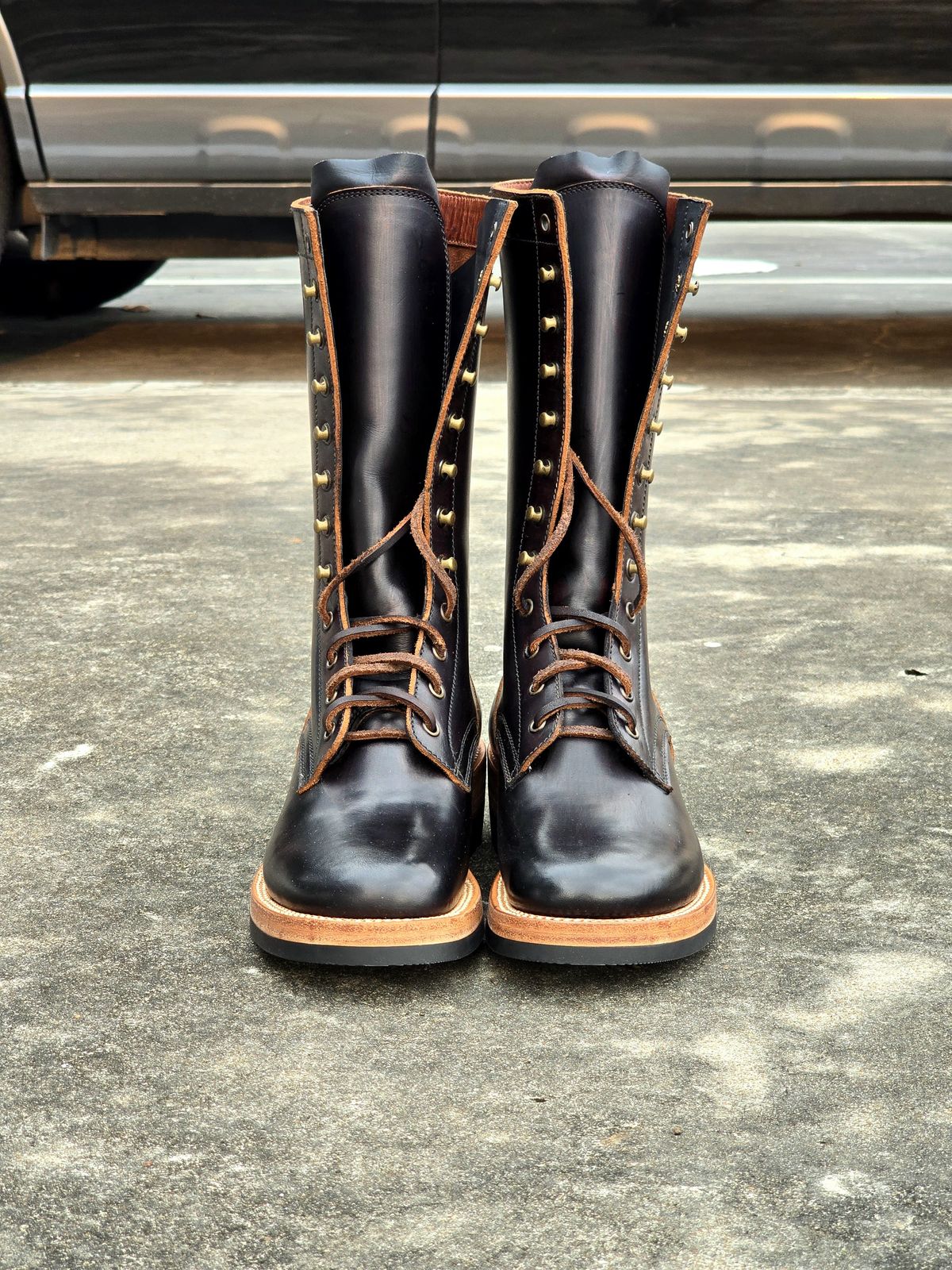 Photo by julio_archieve on October 5, 2025 of the Fortis Boots Logger Boots in Indonesian Red Brown Pull Up Overdyed Black.