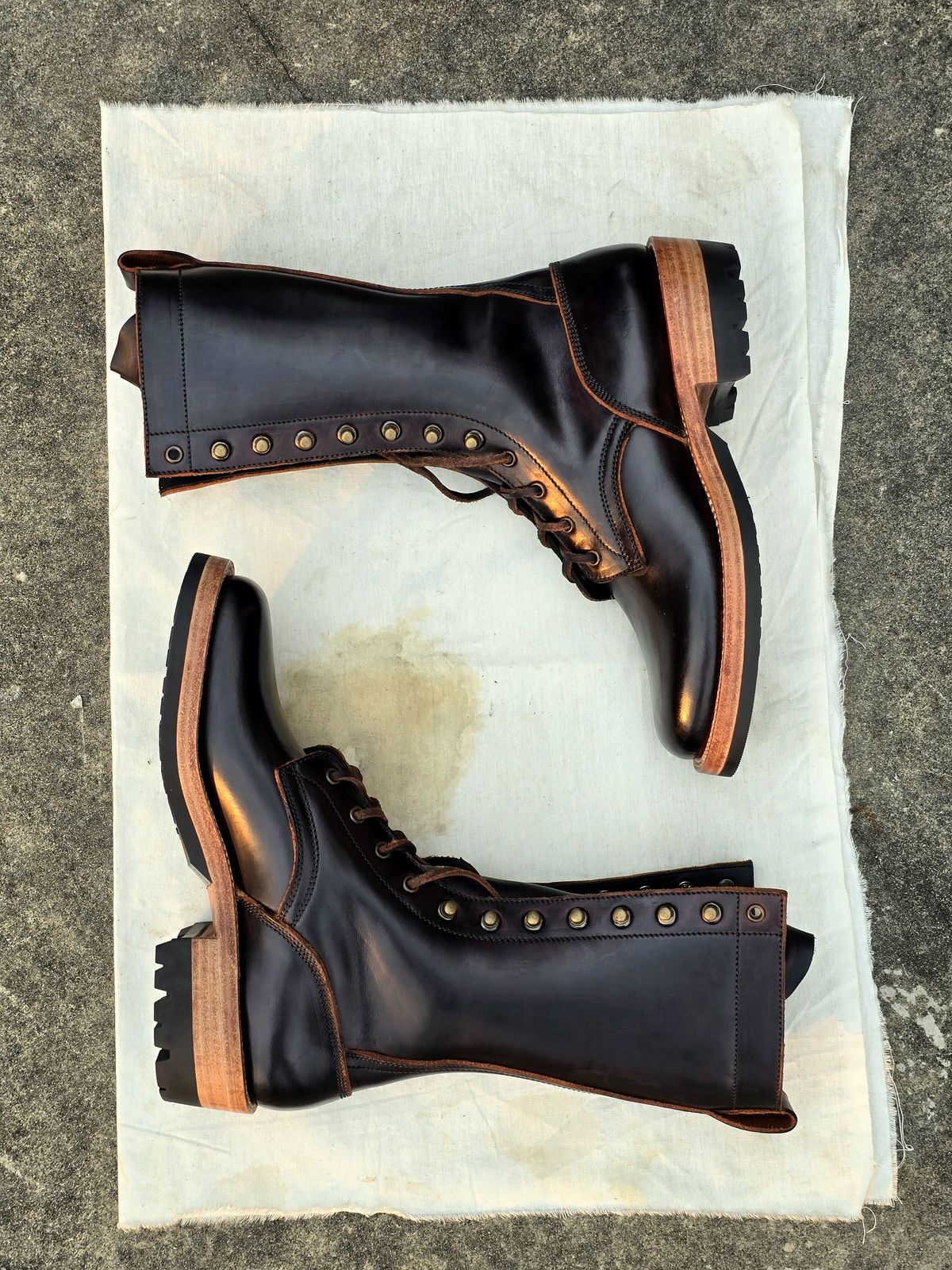 Photo by julio_archieve on October 5, 2025 of the Fortis Boots Logger Boots in Indonesian Red Brown Pull Up Overdyed Black.