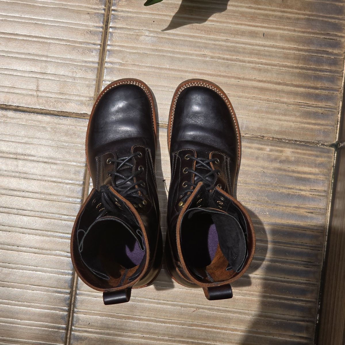 Photo by julio_archieve on November 5, 2025 of the Fortis Boots Logger Boots in Indonesian Red Brown Pull Up Overdyed Black.