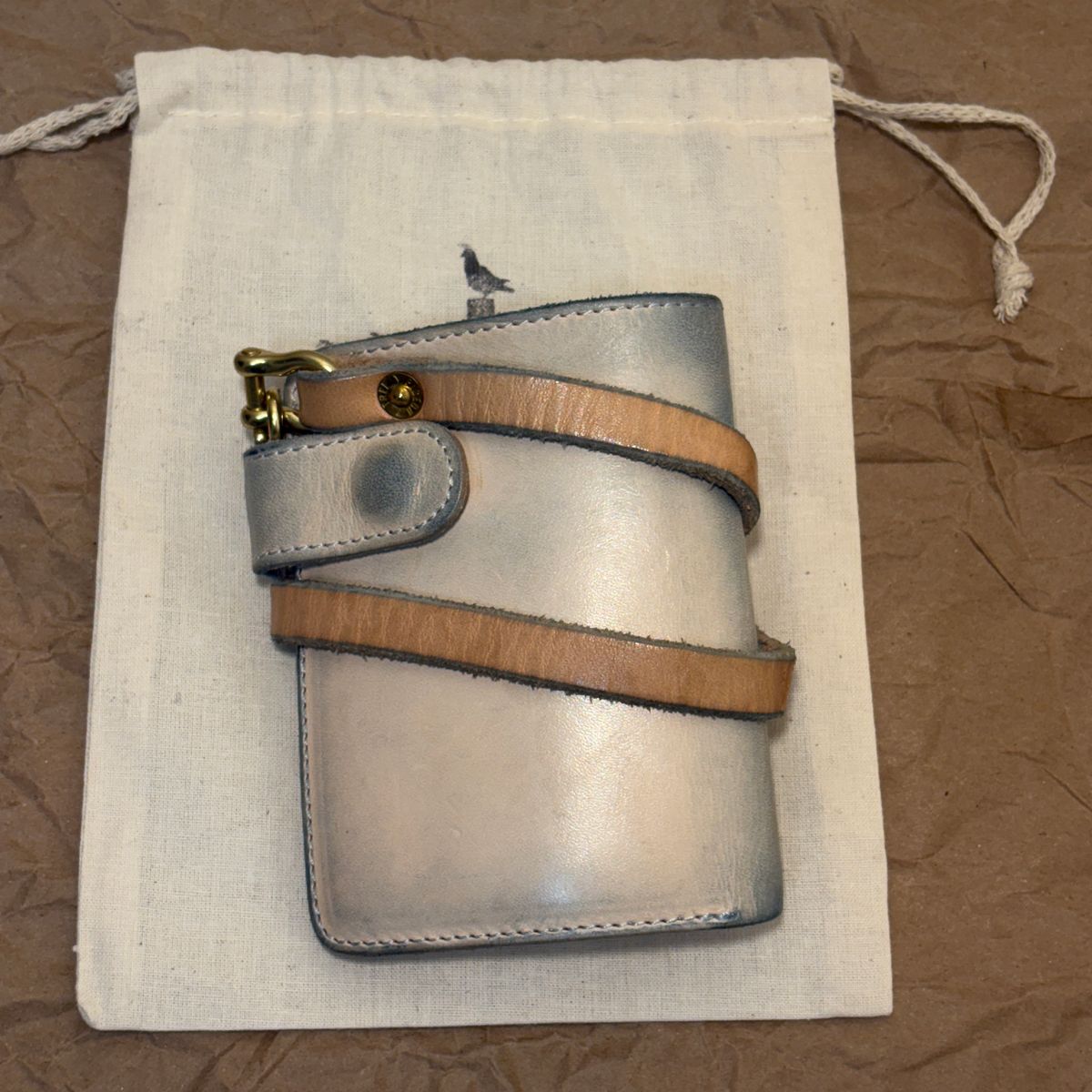 Photo by TastefulGent on January 1, 2026 of the Pigeon Tree Mid-Wallet Snap Bifold Version 3 in Unknown Natural Veg Tan.