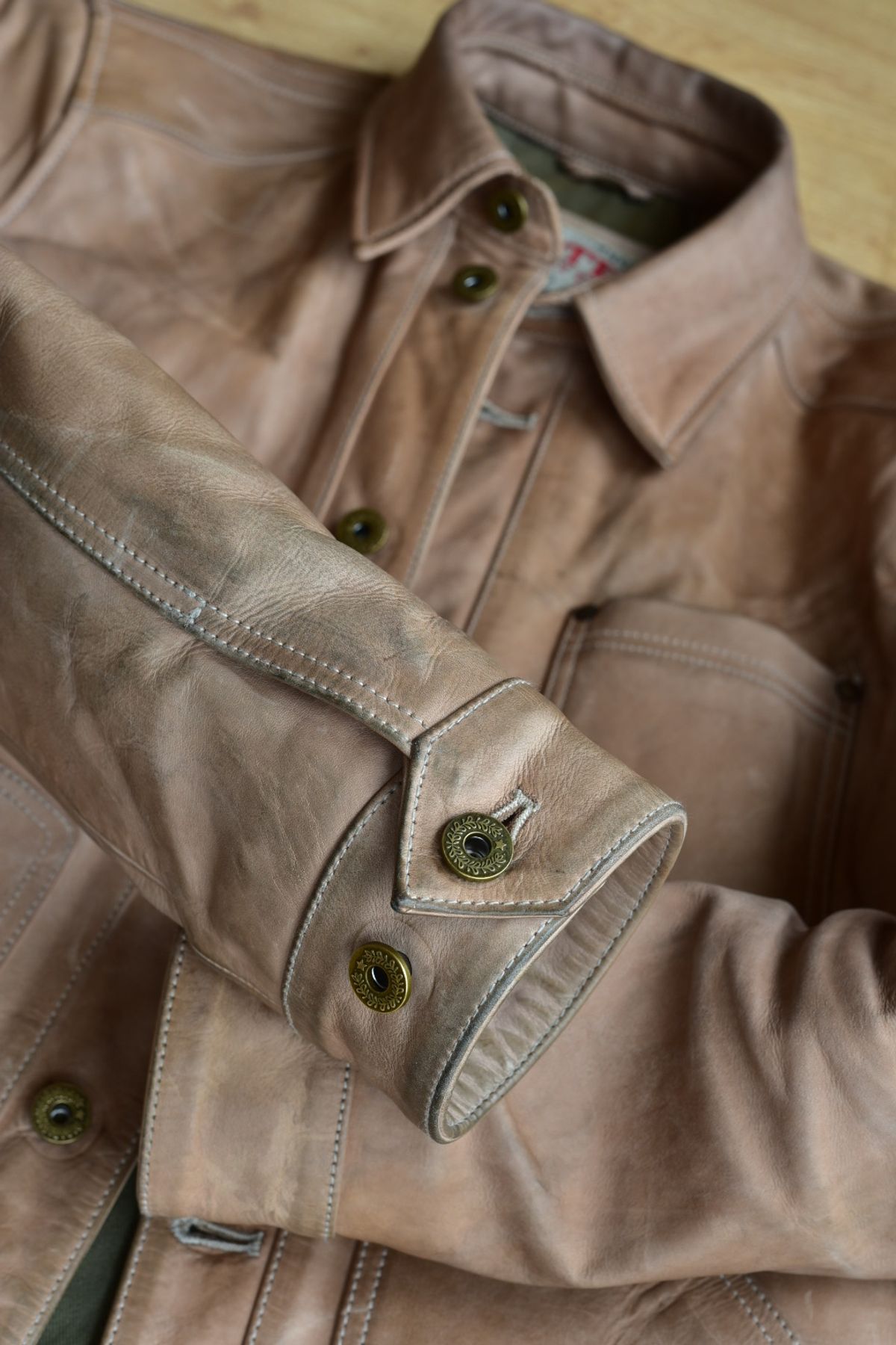 Photo by denimwatchesboots on November 1, 2025 of the Master Supply Co Field Jacket in Veg-Tanned Natural Cowhide.
