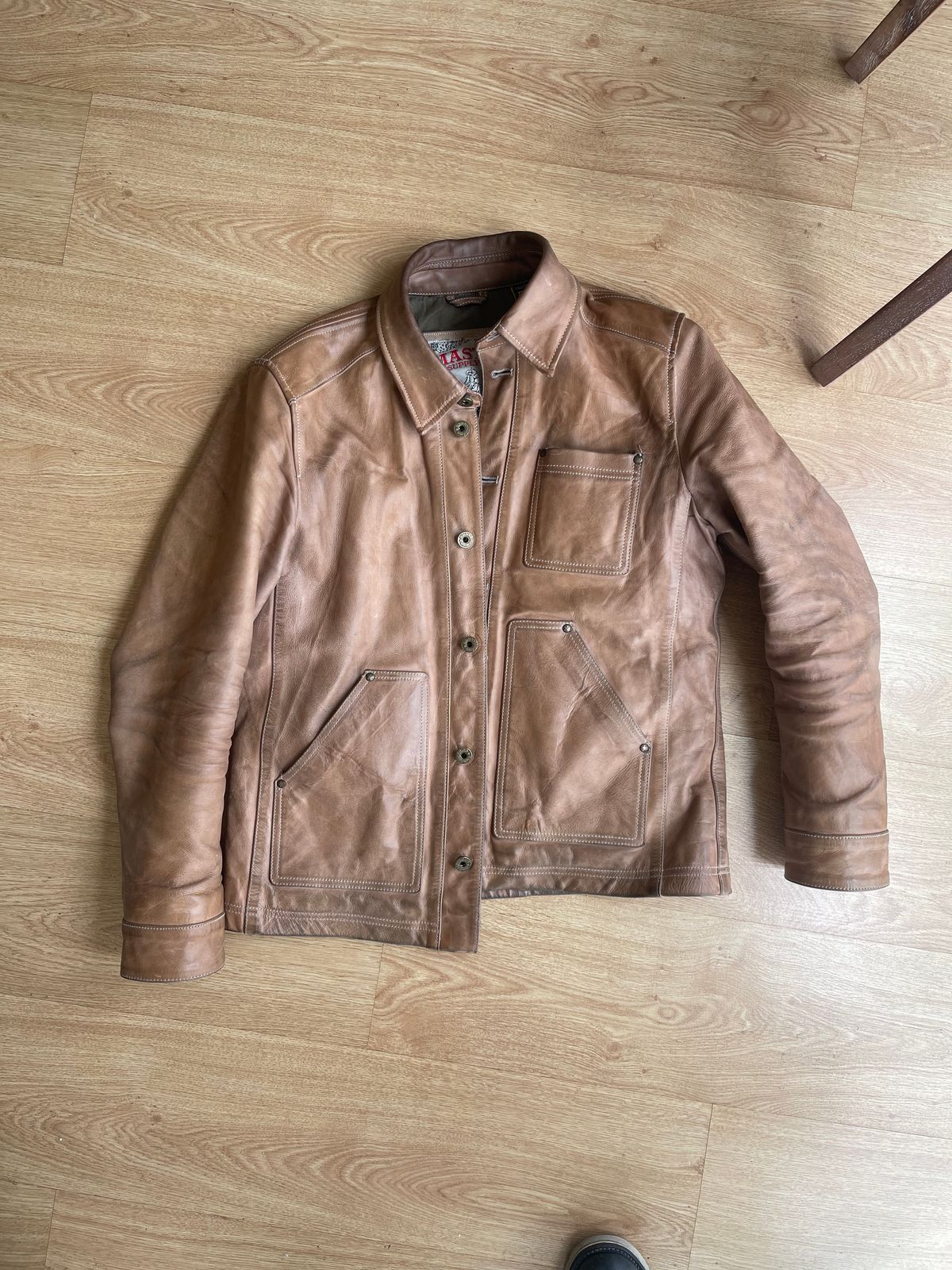 Photo by denimwatchesboots on November 29, 2025 of the Master Supply Co Field Jacket in Veg-Tanned Natural Cowhide.