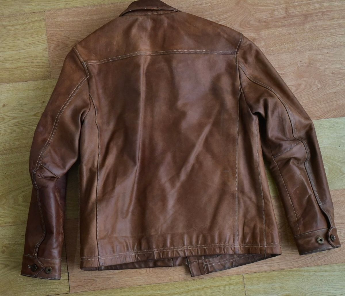 Photo by denimwatchesboots on March 5, 2026 of the Master Supply Co Field Jacket in Veg-Tanned Natural Cowhide.