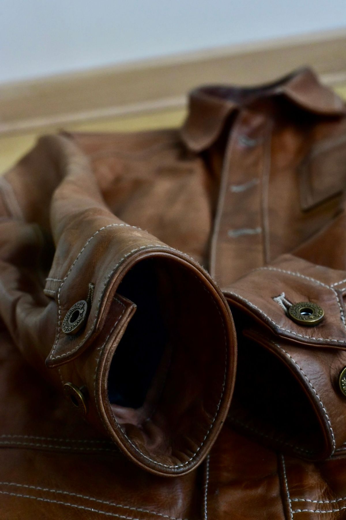 Photo by denimwatchesboots on March 5, 2026 of the Master Supply Co Field Jacket in Veg-Tanned Natural Cowhide.