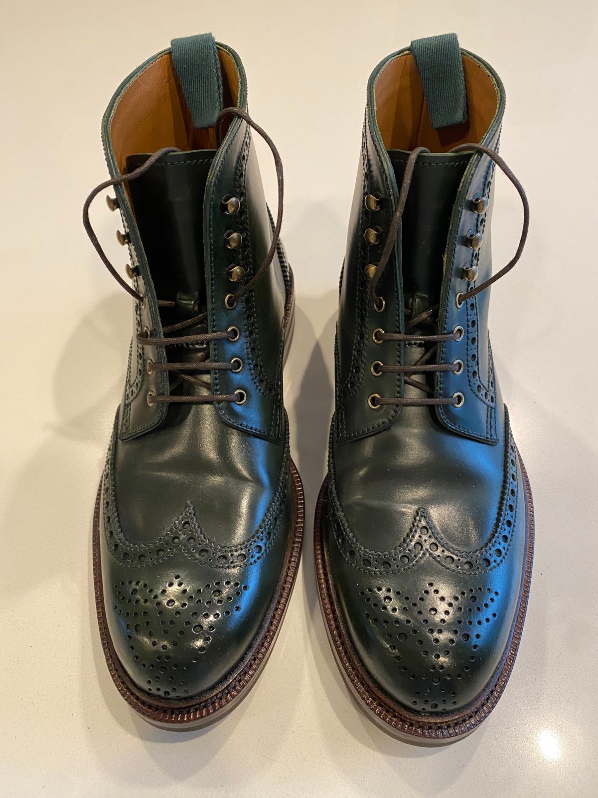Photo by chris.8888 on March 15, 2025 of the Carmina Full-Brogue Jumper Boots 80277 in Horween Green Shell Cordovan.