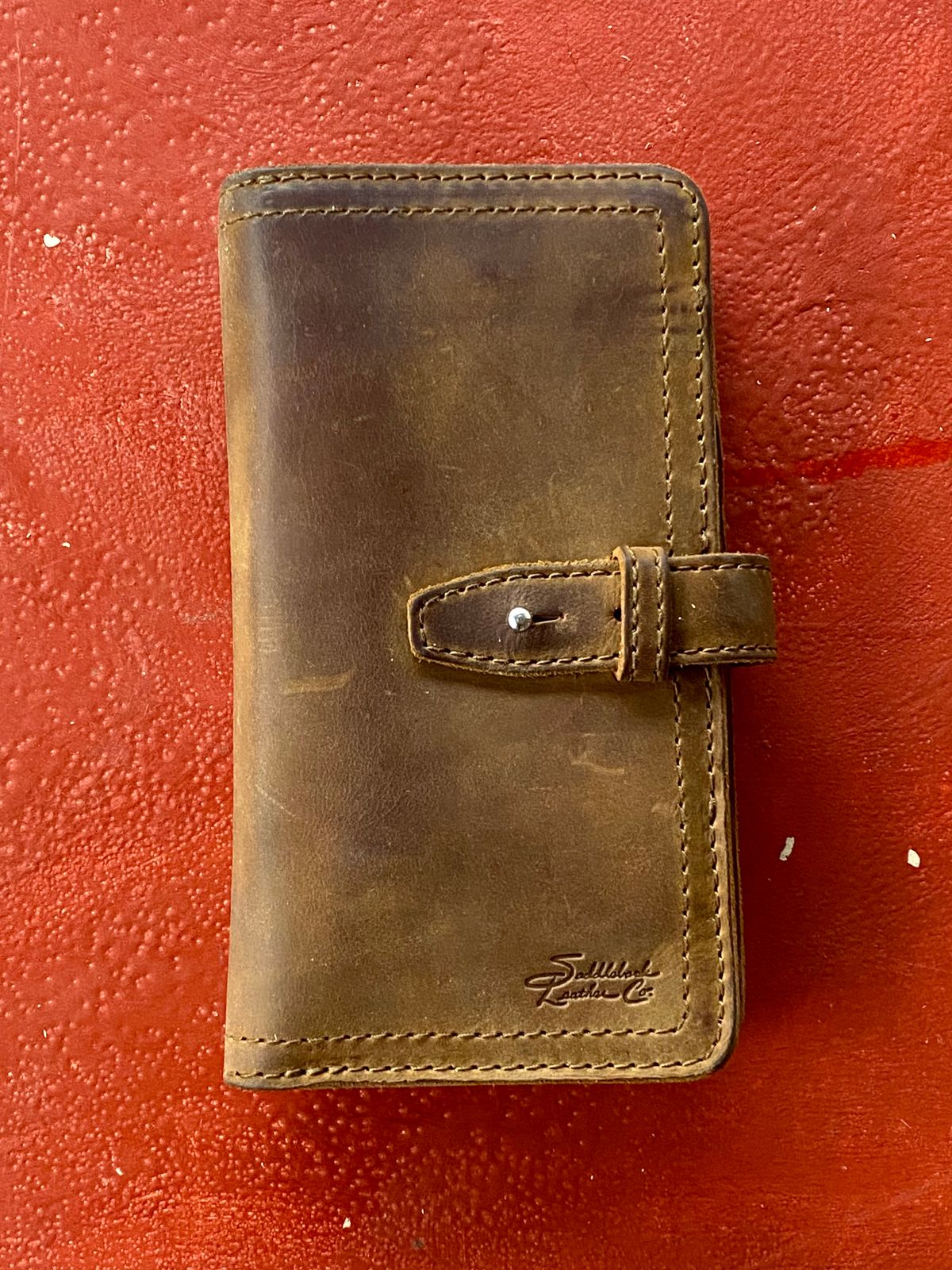 Photo by SerotinousCone on November 6, 2025 of the Saddleback Leather Co. Big Wallet in Tobacco.