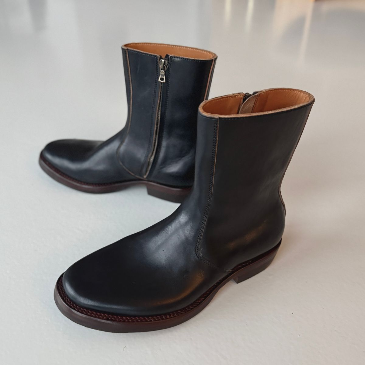 Photo by Sips on December 5, 2025 of the Flame Panda 8“ Zipper Boot in Maryam Natural Horsebutt Overdyed Brown then Black.