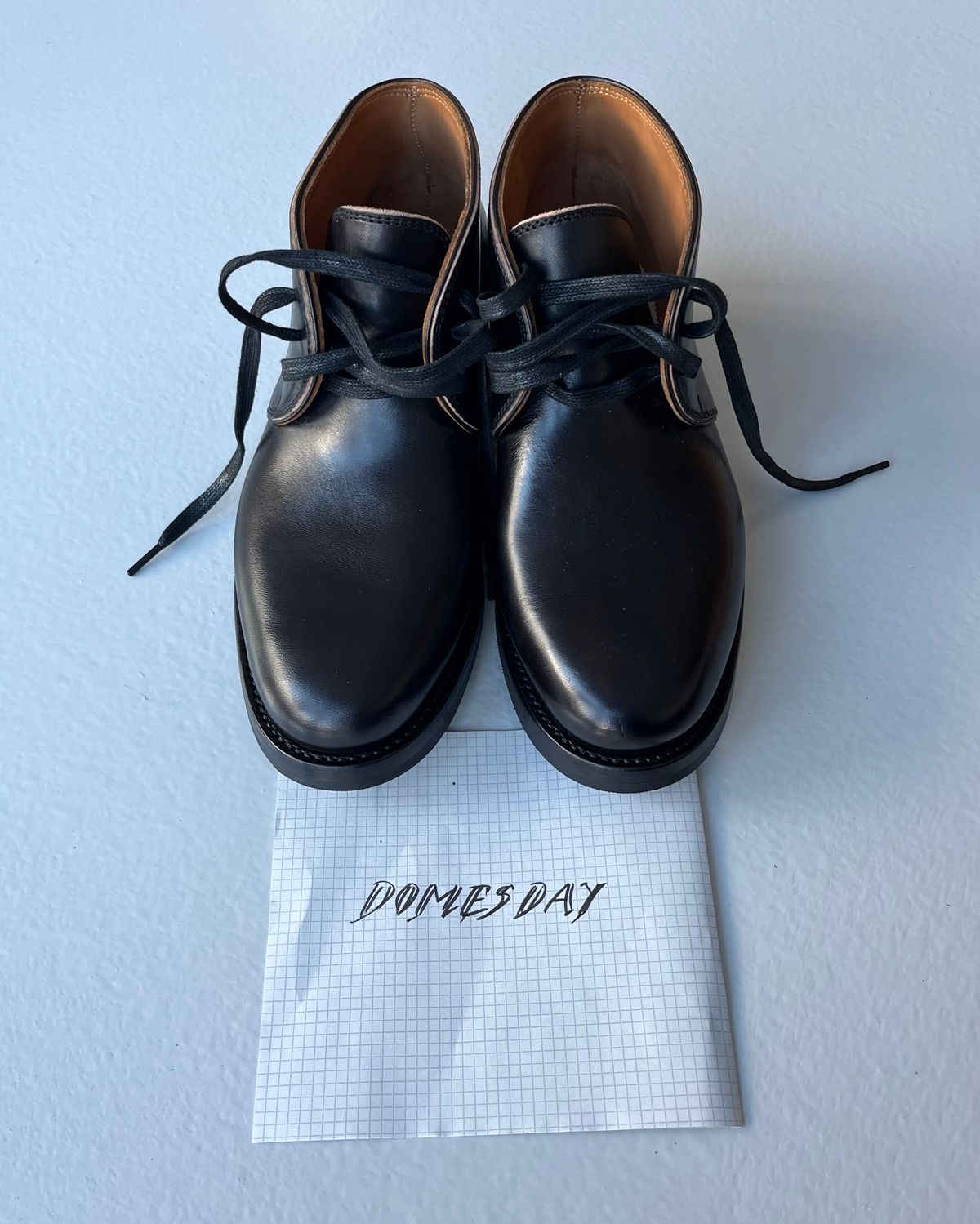 Photo by Sips on October 2, 2024 of the Flame Panda Chukkas in Maryam Natural Horsebutt Overdyed Brown then Black.