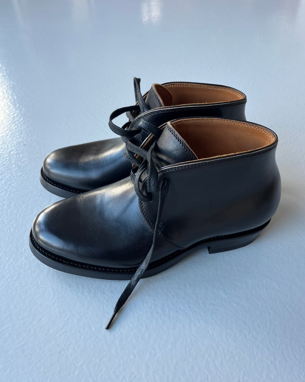 Photo by Sips on October 2, 2024 of the Flame Panda Chukkas in Maryam Natural Horsebutt Overdyed Brown then Black.