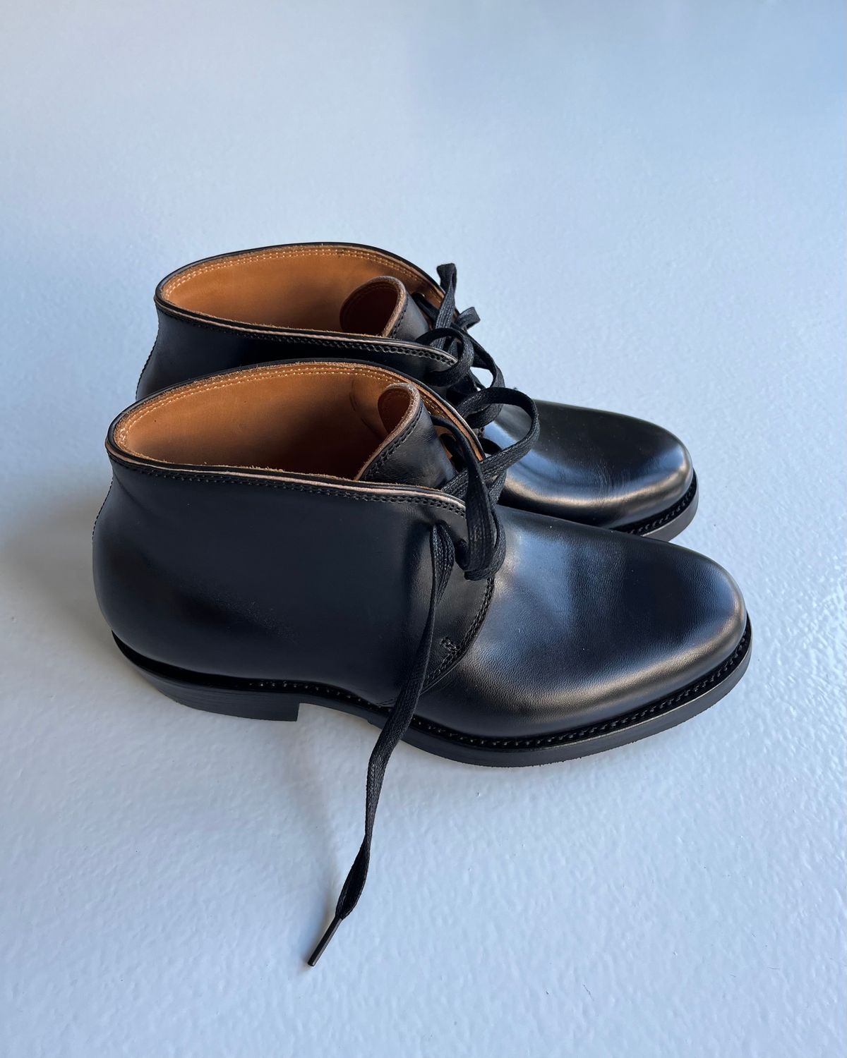 Photo by Sips on October 2, 2024 of the Flame Panda Chukkas in Maryam Natural Horsebutt Overdyed Brown then Black.