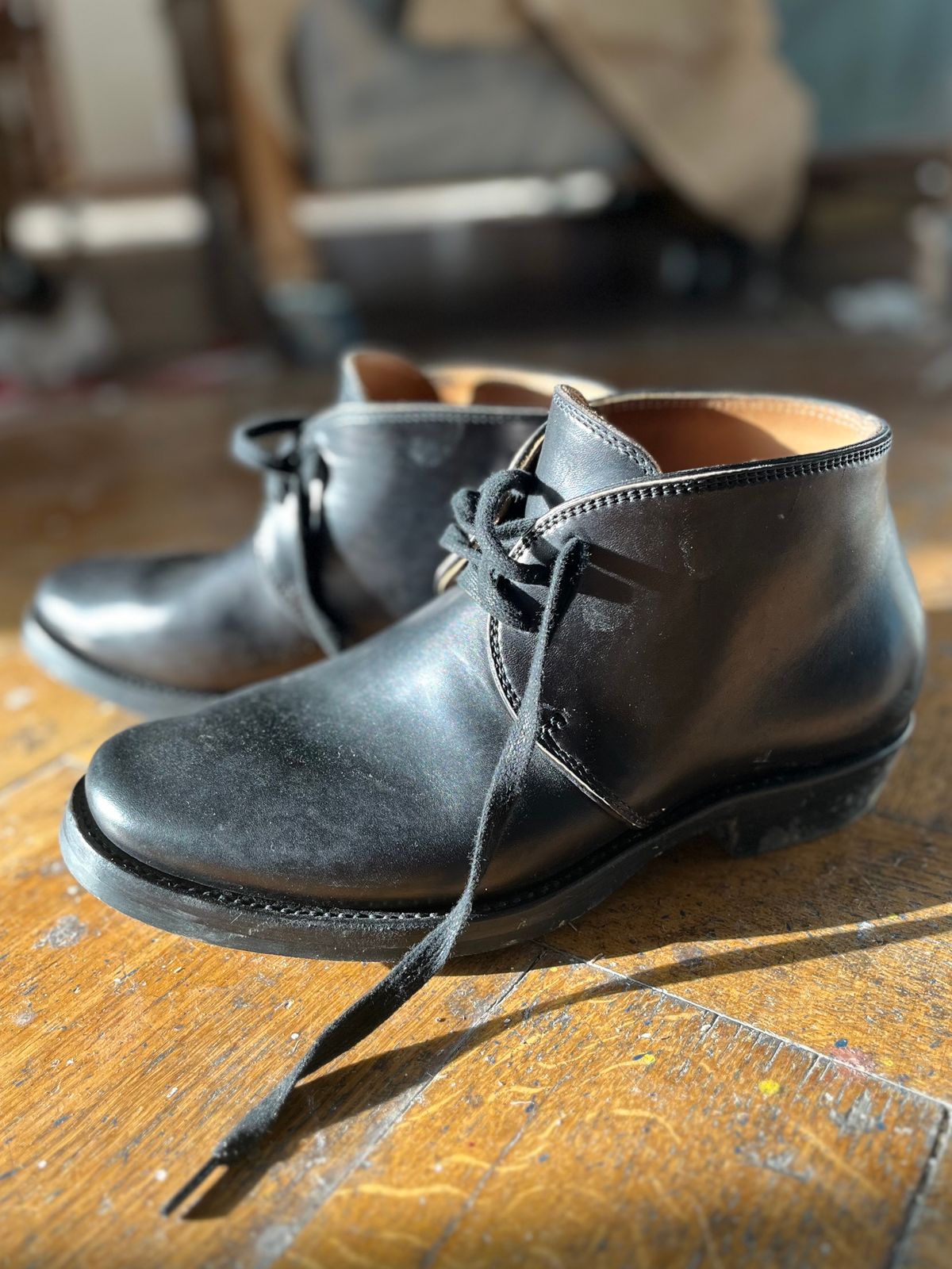 Photo by Sips on January 12, 2025 of the Flame Panda Chukkas in Maryam Natural Horsebutt Overdyed Brown then Black.