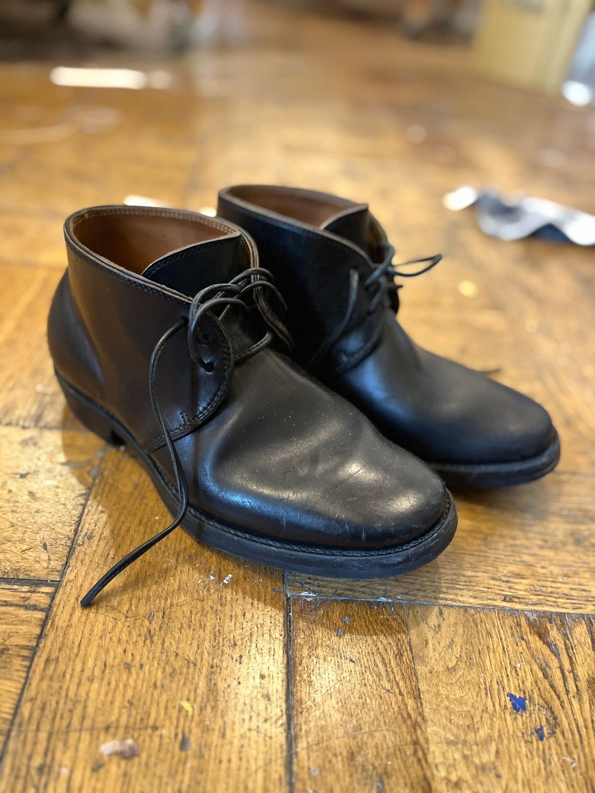 Photo by Sips on March 27, 2025 of the Flame Panda Chukkas in Maryam Natural Horsebutt Overdyed Brown then Black.