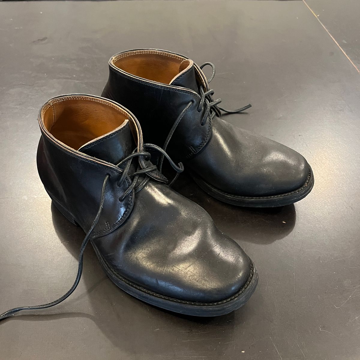 Photo by Sips on May 6, 2025 of the Flame Panda Chukkas in Maryam Natural Horsebutt Overdyed Brown then Black.