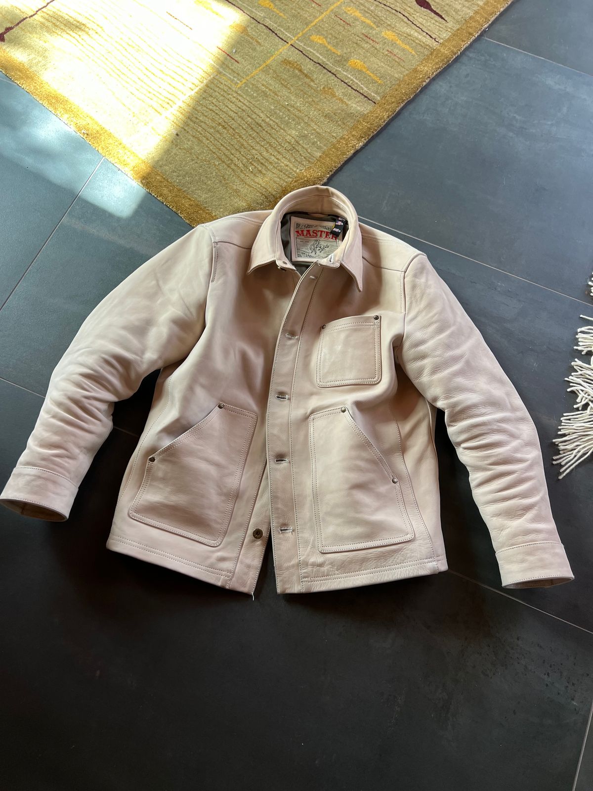 Photo by Tipples_and_drams on March 7, 2025 of the Master Supply Field Jacket in Unknown Natural Veg Tan Cowhide.