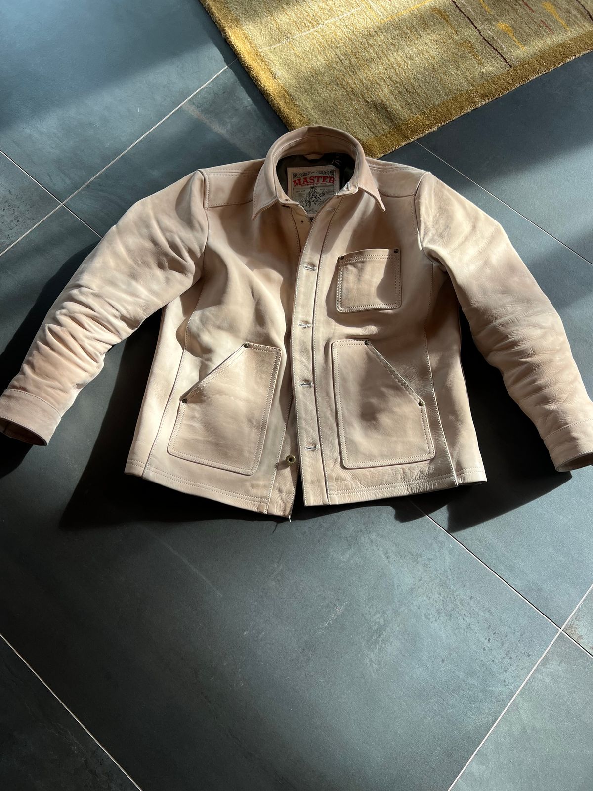 Photo by Tipples_and_drams on March 21, 2025 of the Master Supply Field Jacket in Unknown Natural Veg Tan Cowhide.