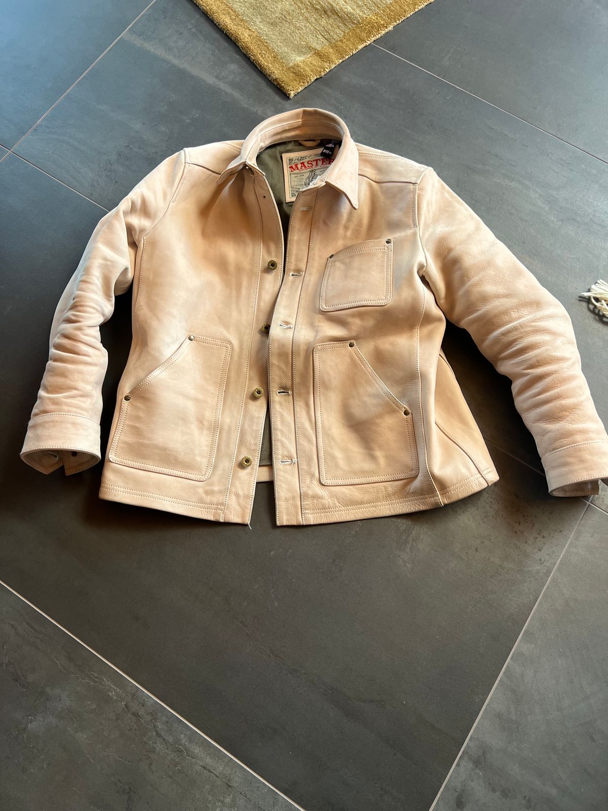 Photo by Tipples_and_drams on March 22, 2025 of the Master Supply Field Jacket in Unknown Natural Veg Tan Cowhide.