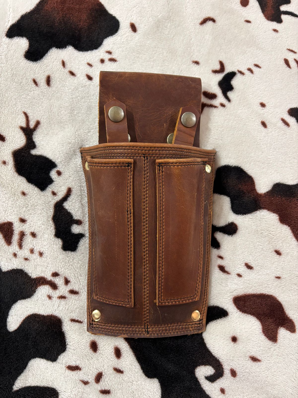 Photo by milezhendricks on October 6, 2025 of the Hubble Creek Boots convertible tool pouch V1 in Horween Cognac Predator.