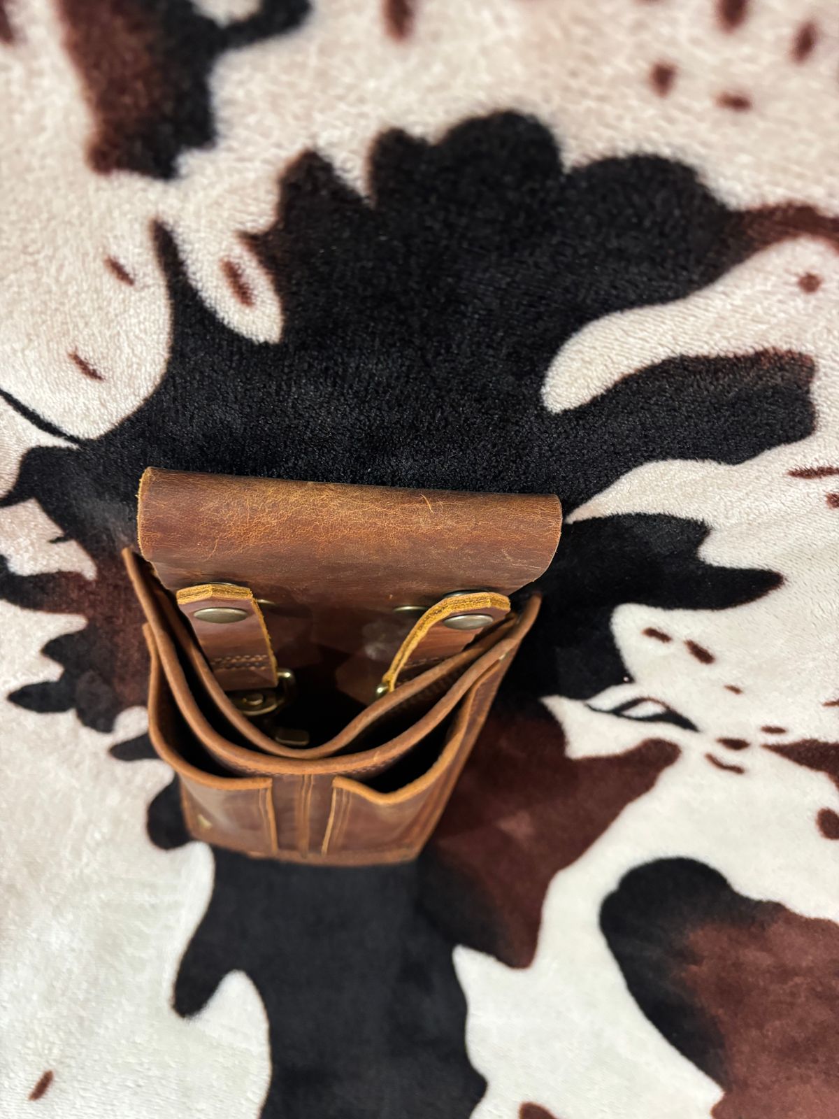 Photo by milezhendricks on October 6, 2025 of the Hubble Creek Boots convertible tool pouch V1 in Horween Cognac Predator.