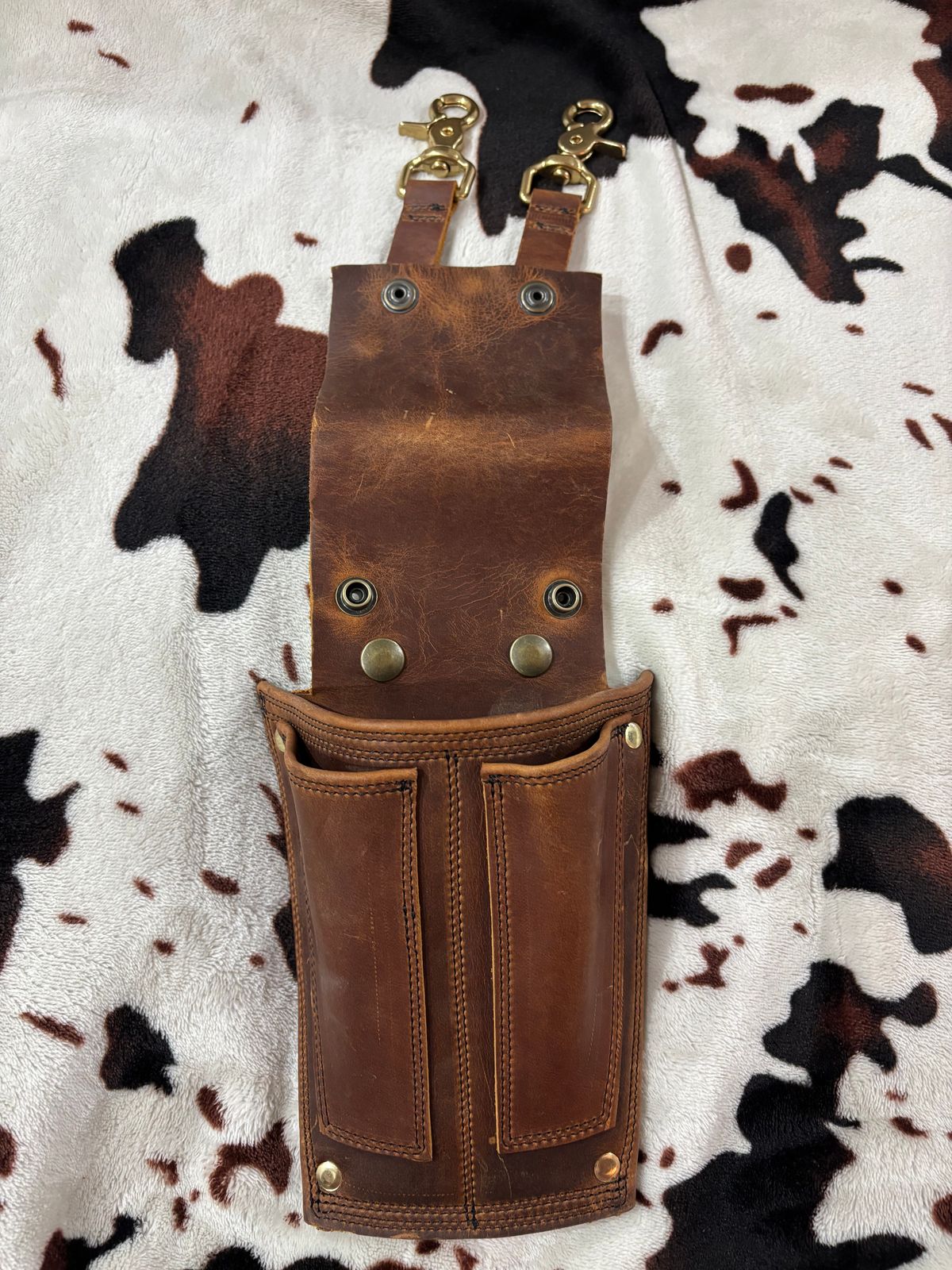 Photo by milezhendricks on October 6, 2025 of the Hubble Creek Boots convertible tool pouch V1 in Horween Cognac Predator.