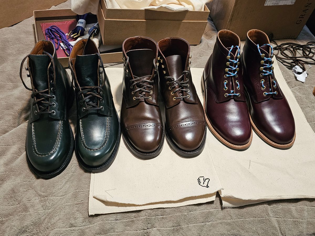 Photo by Boosted on June 25, 2026 of the Grant Stone Brass Boot in Horween Navy Chromexcel.