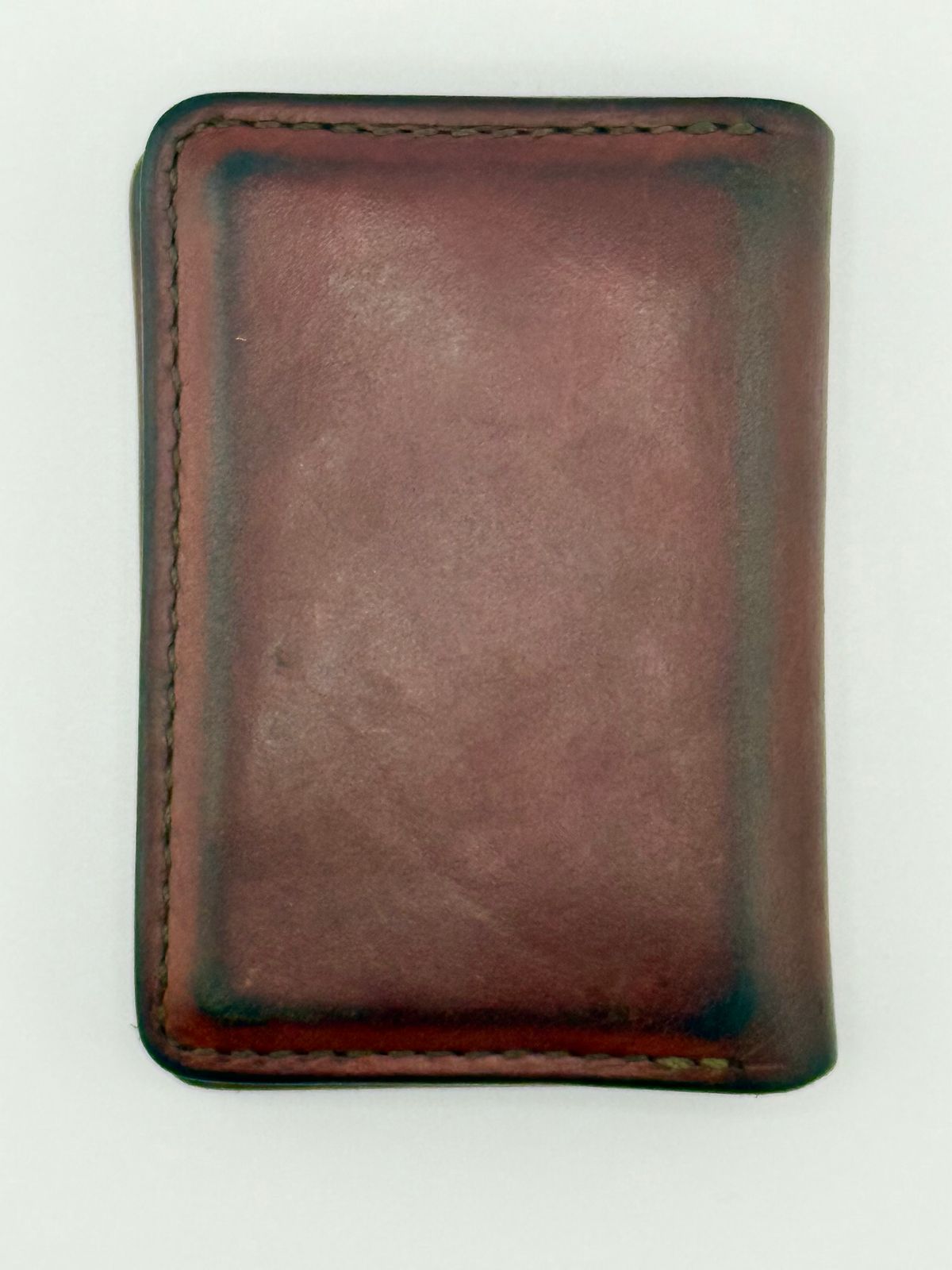 Photo by jeremy.m.boyd on April 3, 2026 of the Jeremy Boyd The JRNY Front Pocket BiFold in Tandy’s Economy Veg-Tan Hand Died English Bridle.