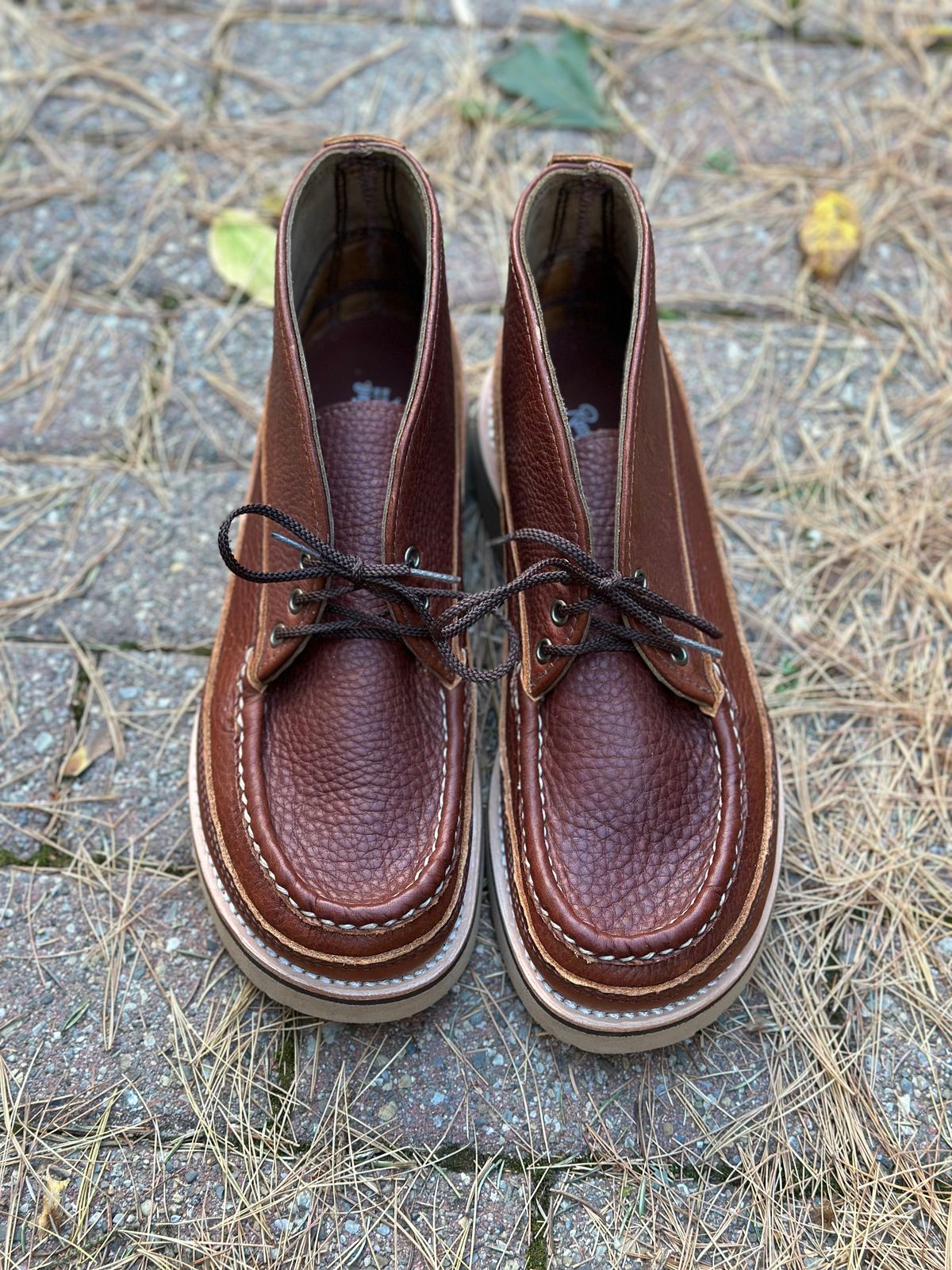 Photo by stitchdown on October 15, 2024 of the Russell Moccasin Co. Sporting Clays Chukka in Seidel Lt Saddle Adirondack.