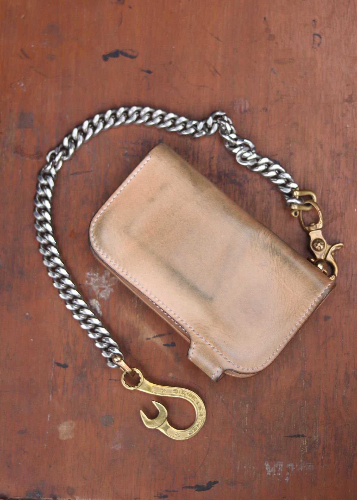 Photo by januardwijuang on November 30, 2025 of the Siege Leather Middle Concho Wallet in Indonesian Natural Veg Tan.