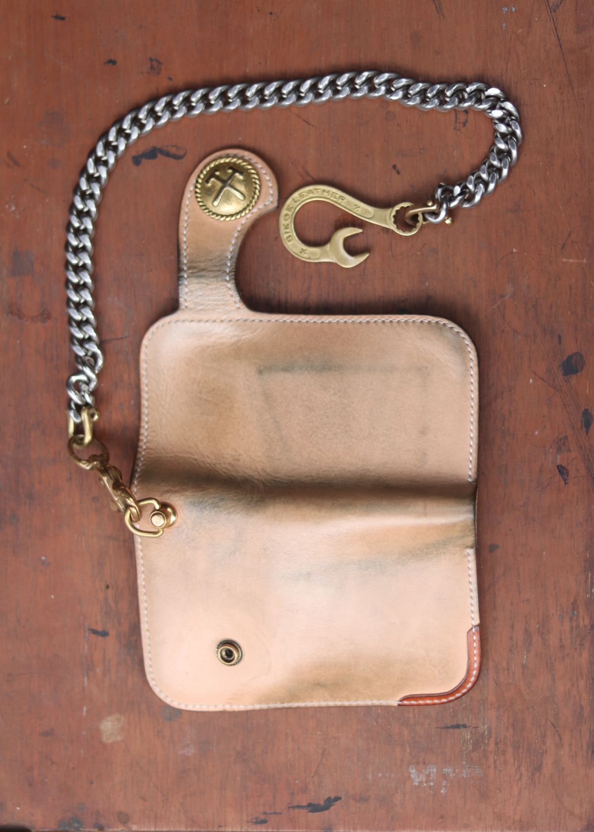 Photo by januardwijuang on November 30, 2025 of the Siege Leather Middle Concho Wallet in Indonesian Natural Veg Tan.