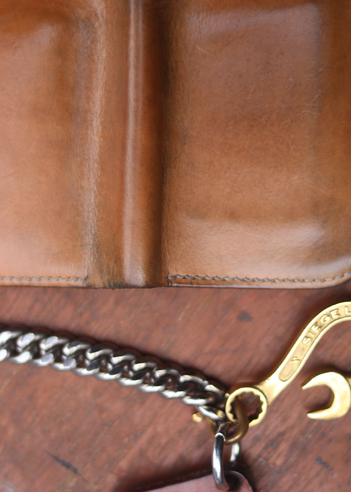 Photo by januardwijuang on March 1, 2026 of the Siege Leather Middle Concho Wallet in Indonesian Natural Veg Tan.