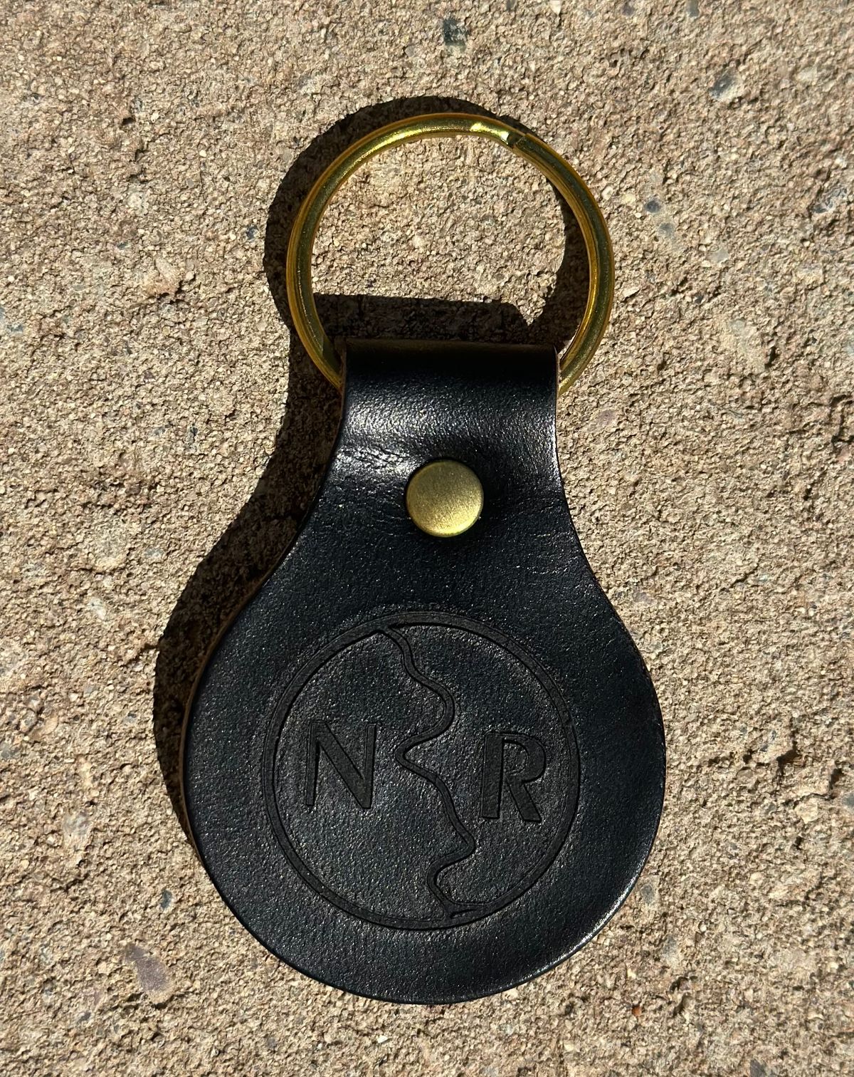 Photo by austinrylees on October 3, 2025 of the New River Boot Keychain in Horse Front Strips.