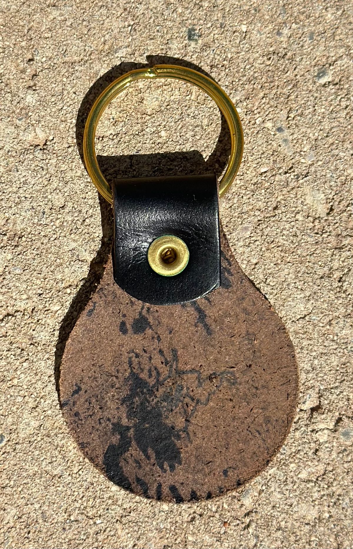 Photo by austinrylees on October 3, 2025 of the New River Boot Keychain in Horse Front Strips.