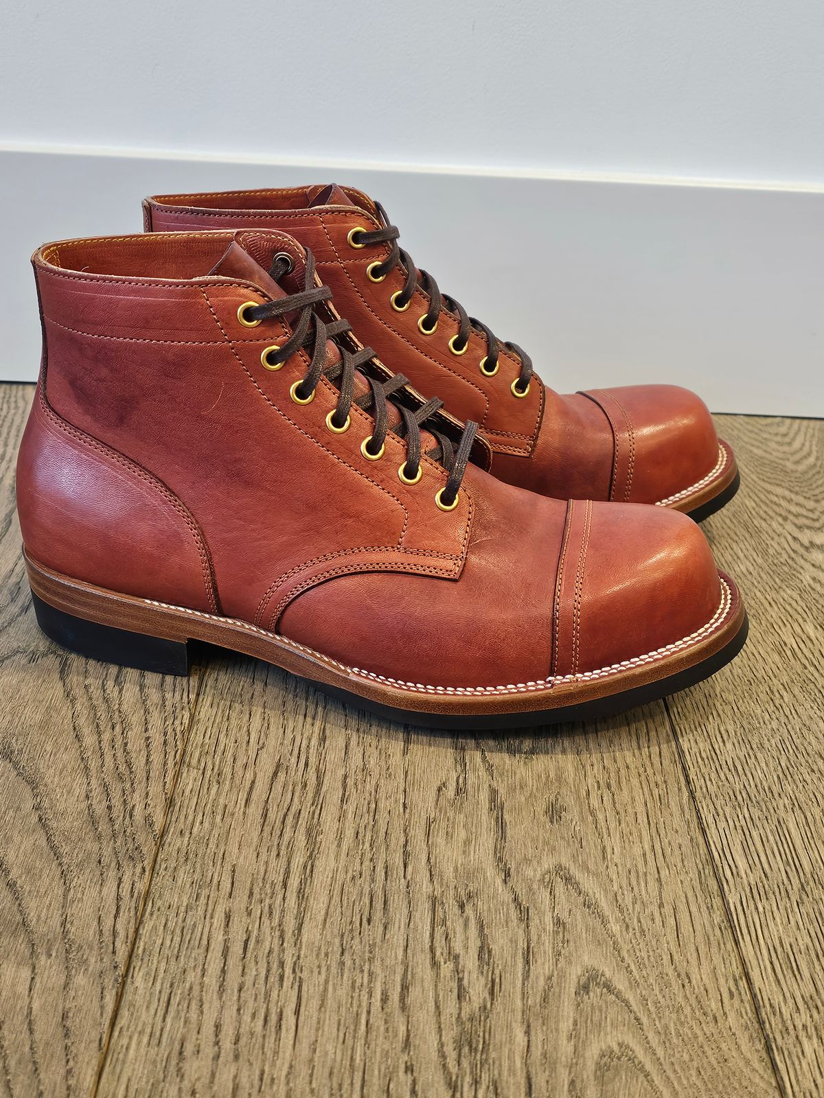 Photo by cgbaird2 on November 4, 2024 of the Iron Boots Pitman in Maryam Brick Red Hand-Dyed Horsehide.