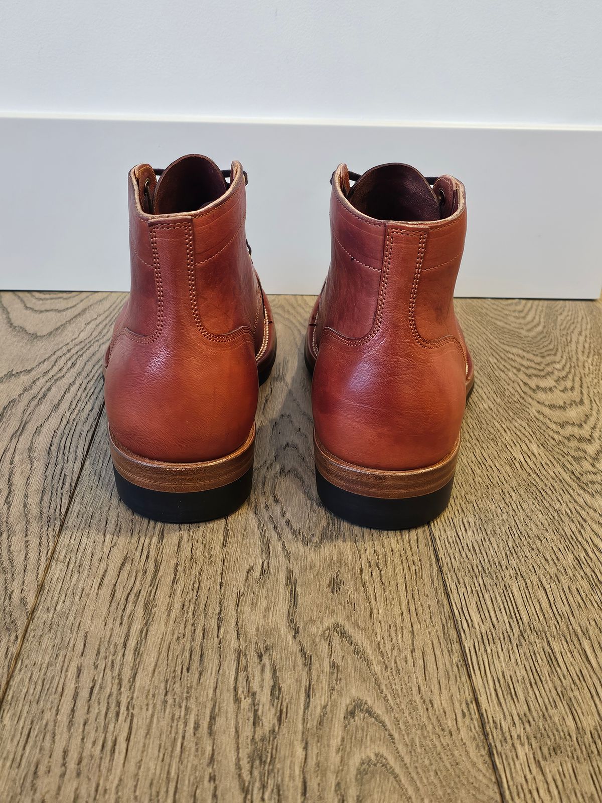 Photo by cgbaird2 on November 6, 2024 of the Iron Boots Pitman in Maryam Brick Red Hand-Dyed Horsehide.